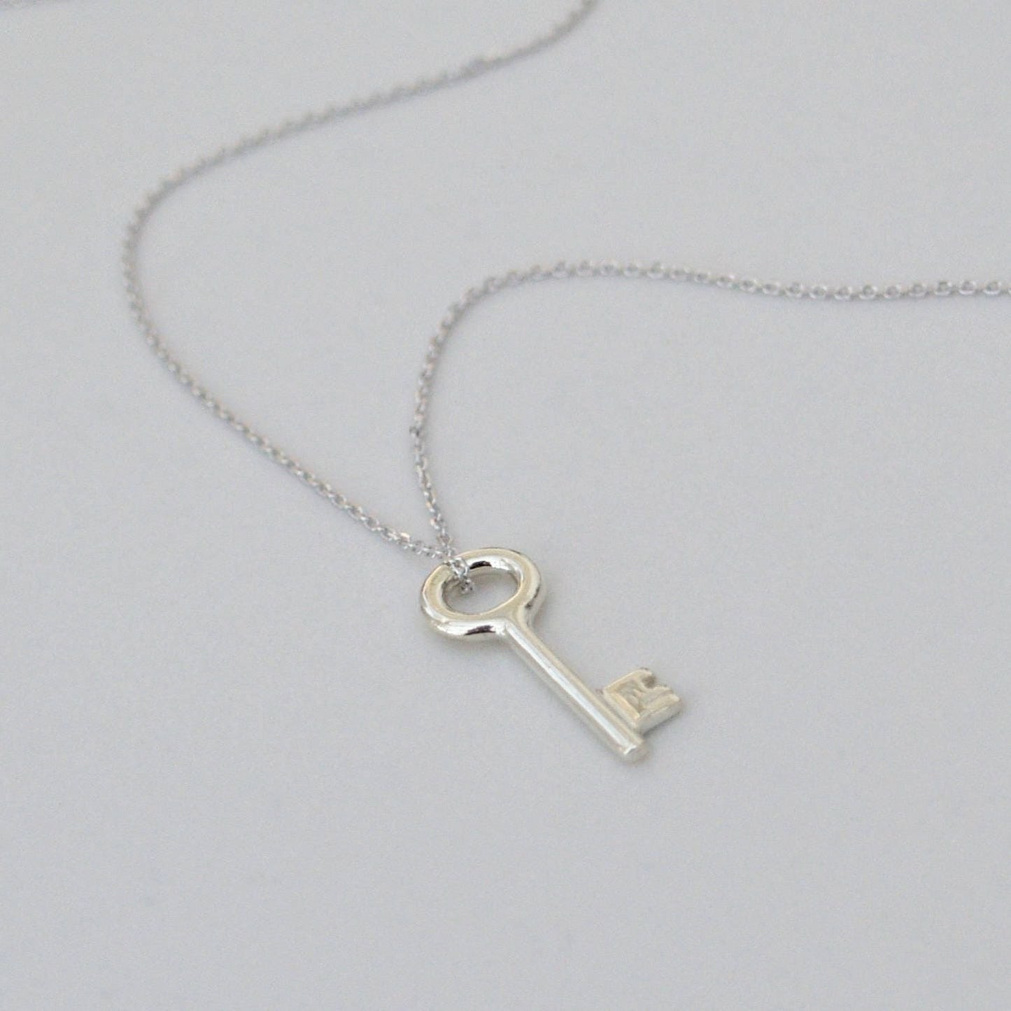 9ct solid white gold small and dainty key charm pendant and chain