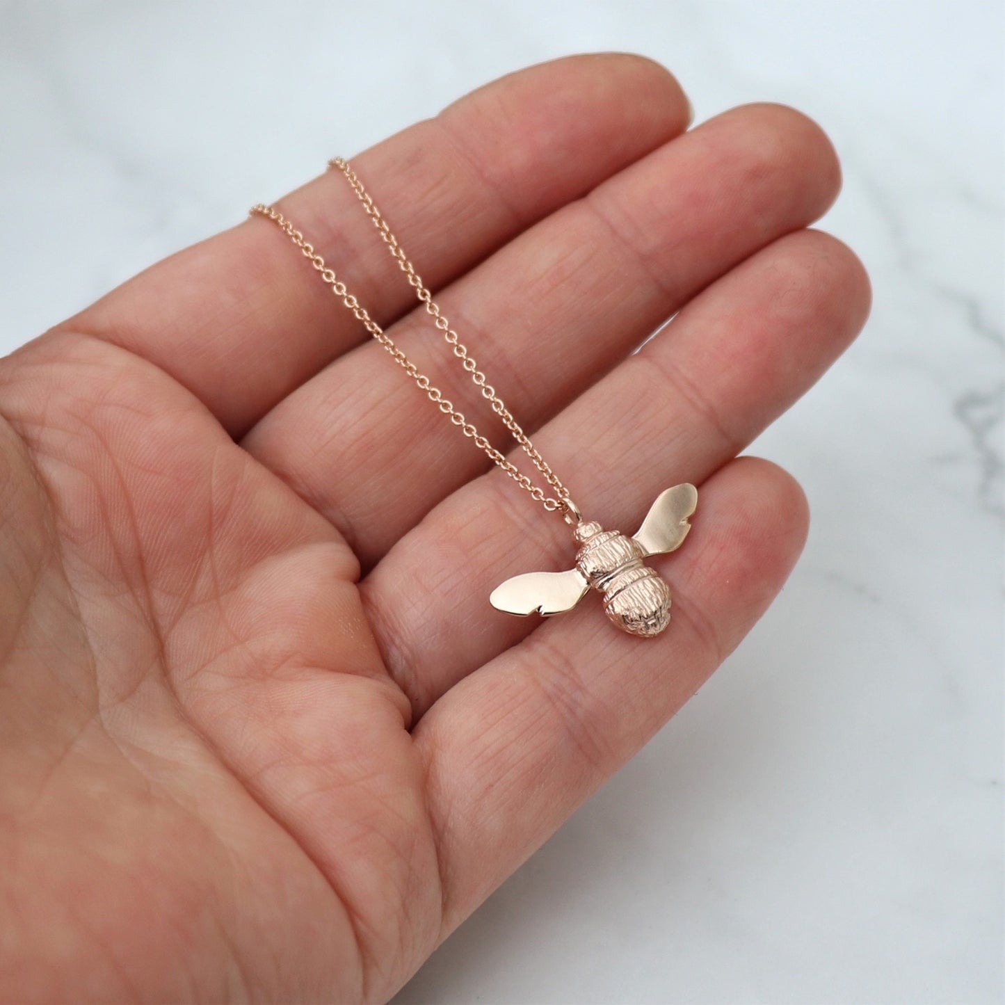 9ct solid rose gold Bumblebee pendant on a 9ct rose gold trace chain