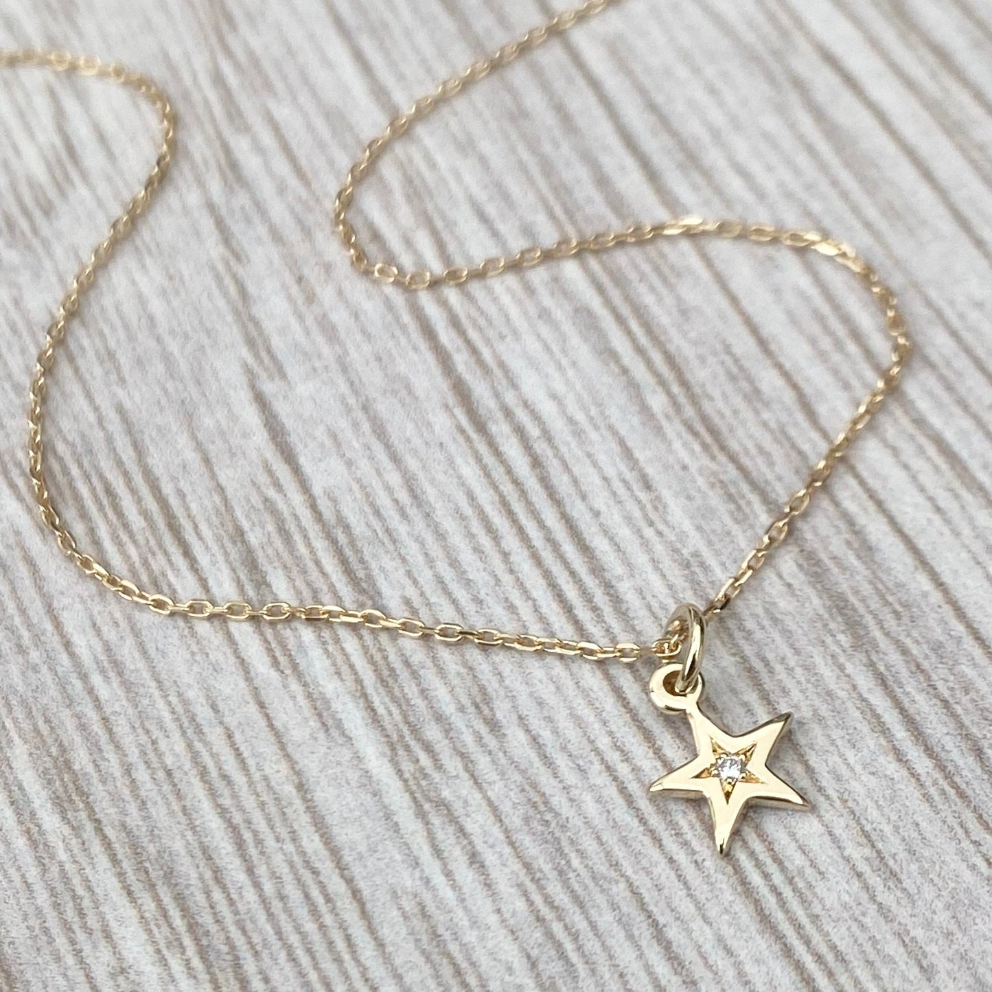 9ct solid yellow gold star engraved diamond tiny star charm pendant and chain.
