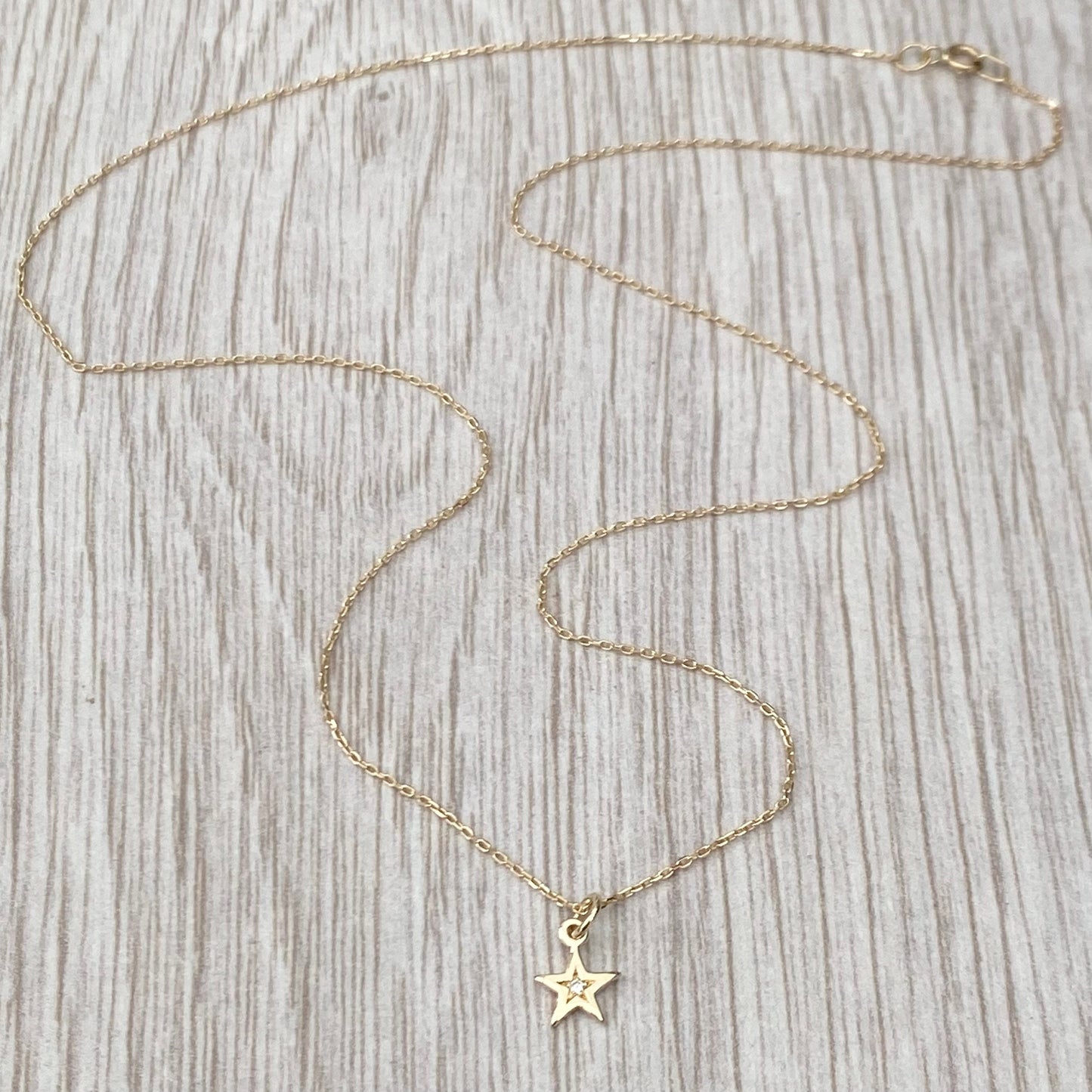 9ct solid yellow gold star engraved diamond tiny star charm pendant and chain.