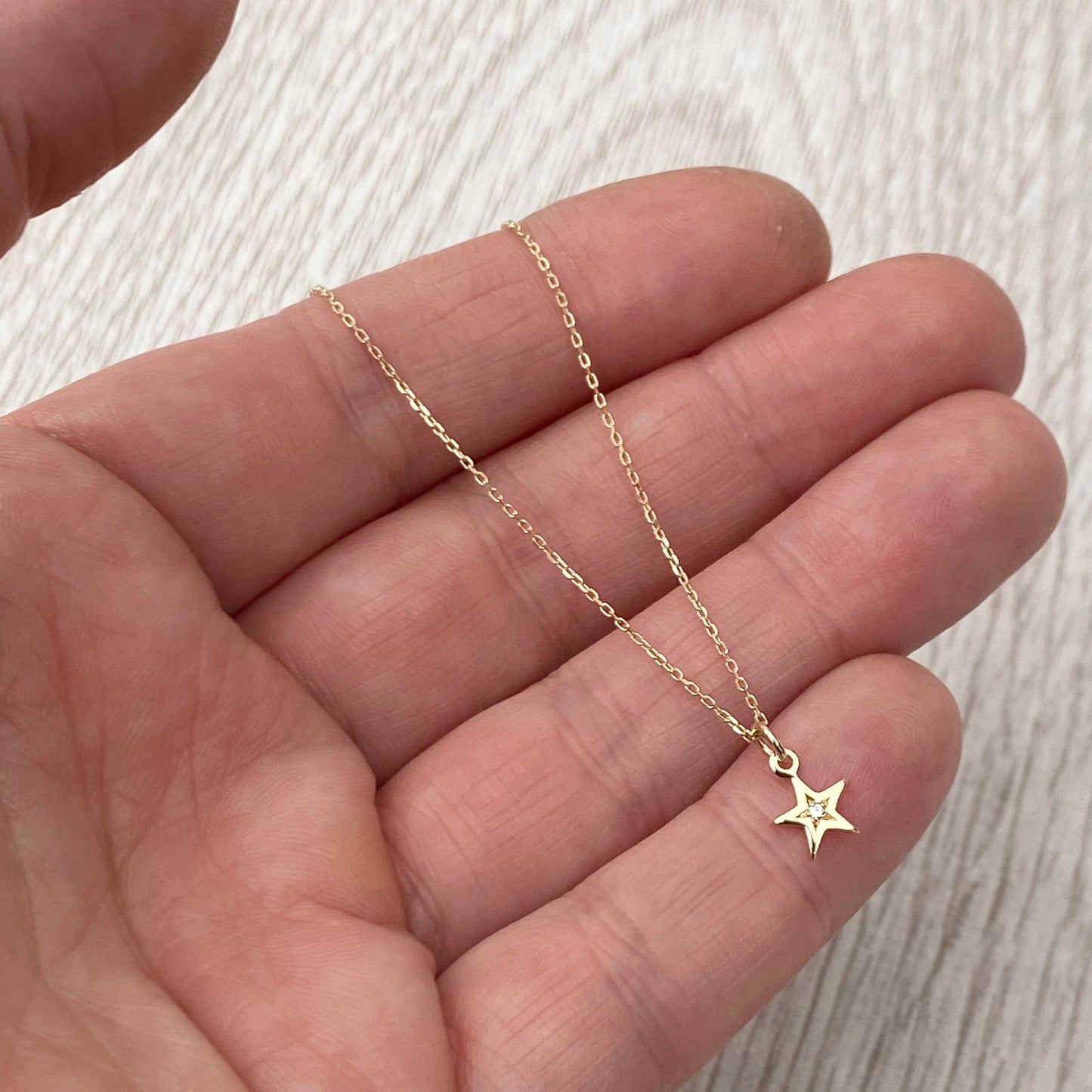9ct solid yellow gold star engraved diamond tiny star charm pendant and chain.