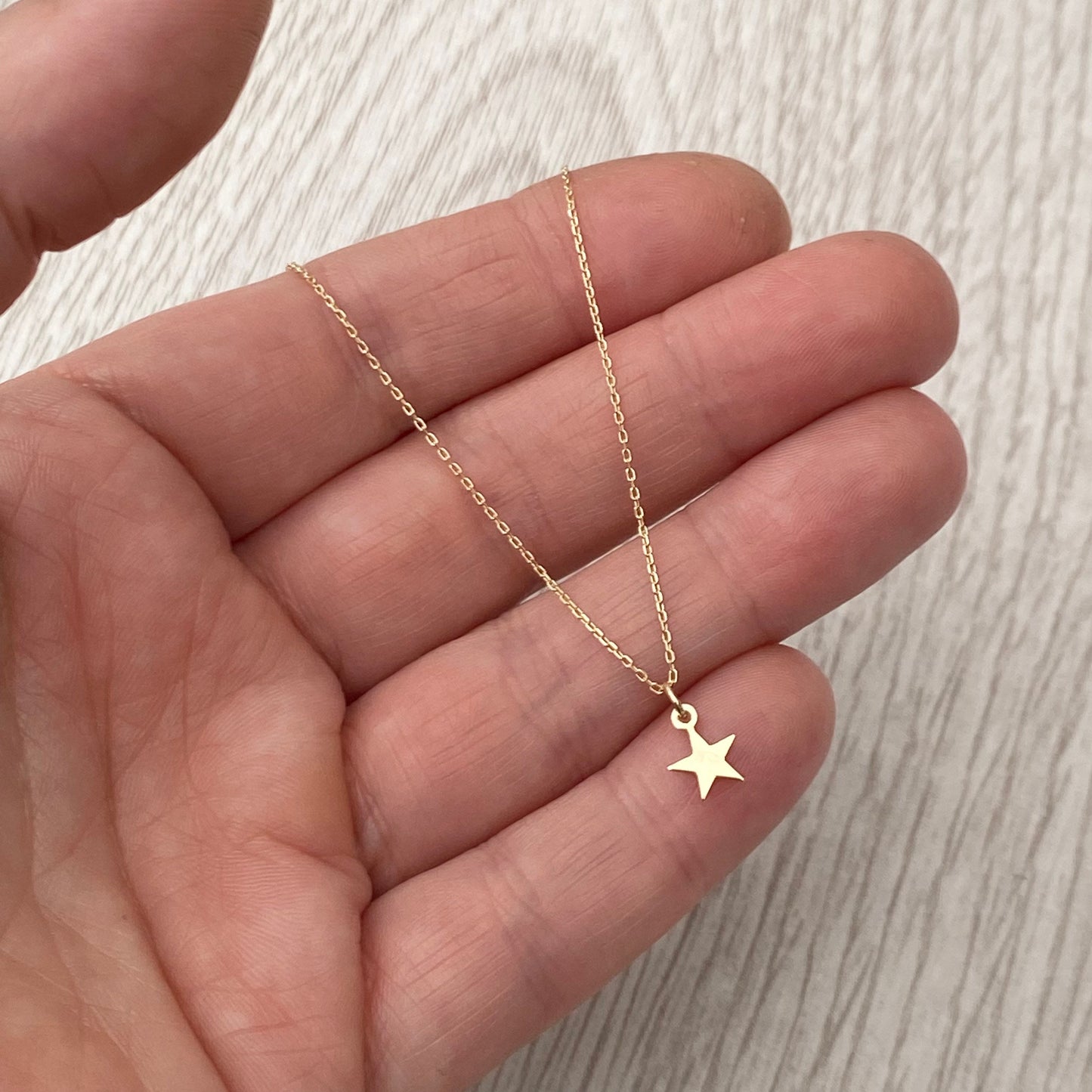 9ct solid yellow gold star engraved diamond tiny star charm pendant and chain.