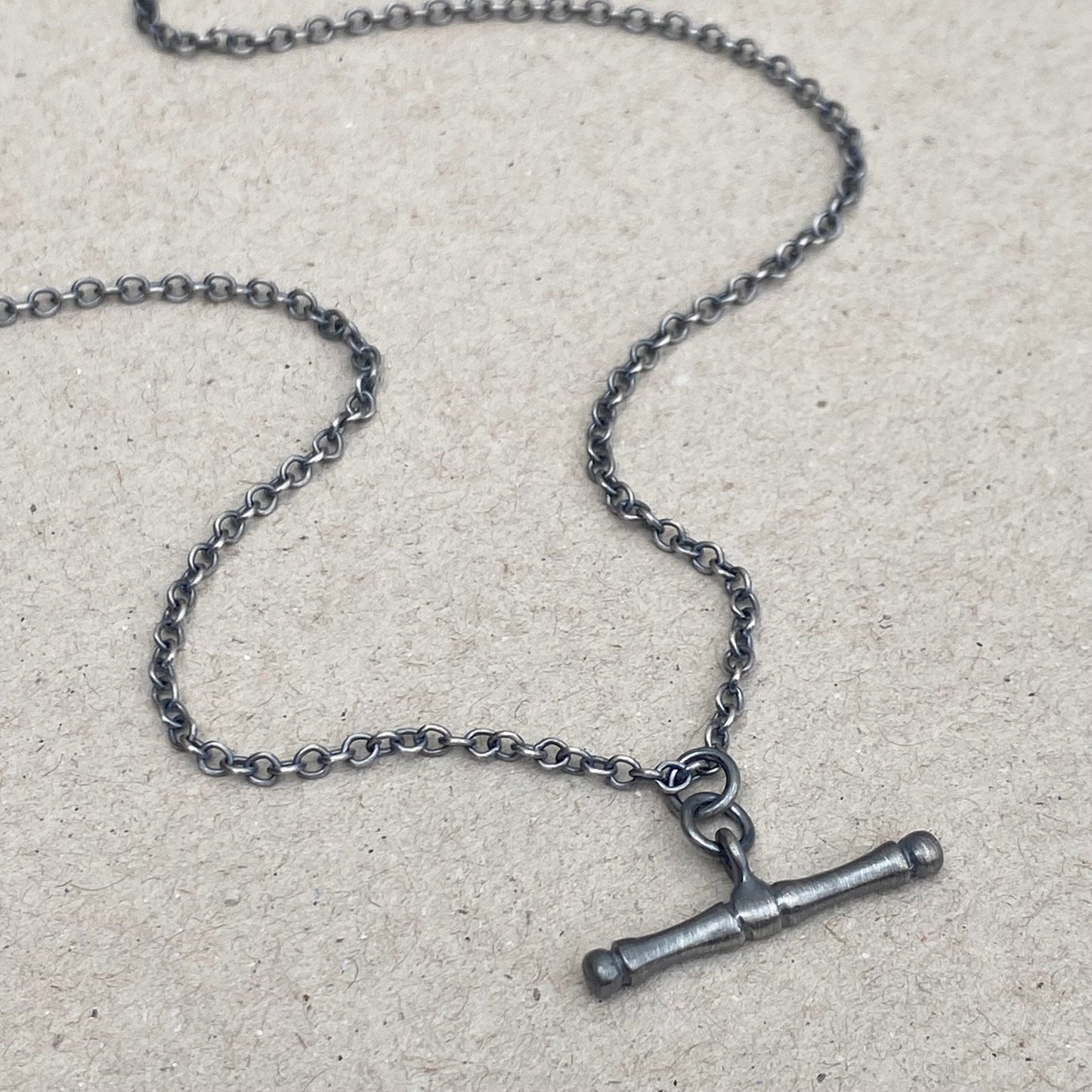 Oxidised or polished solid silver T-bar pendant on a trace chain