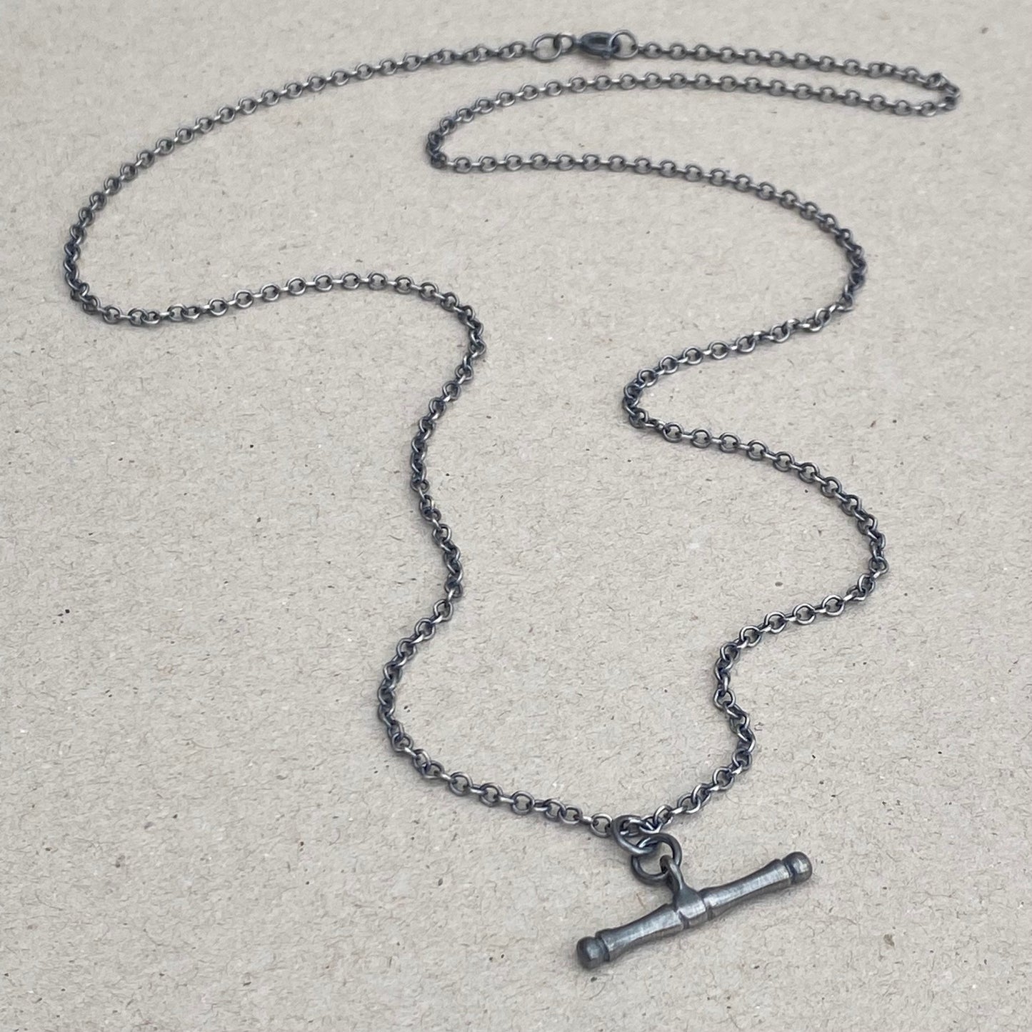 Oxidised or polished solid silver T-bar pendant on a trace chain
