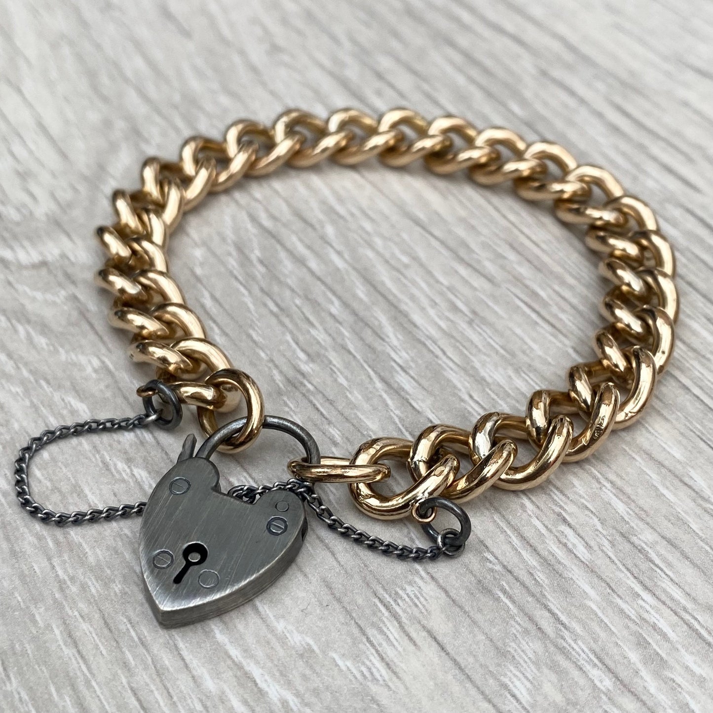 Vintage rolled gold curb chain 7.5" bracelet with a renewed oxidised silver heart locket
