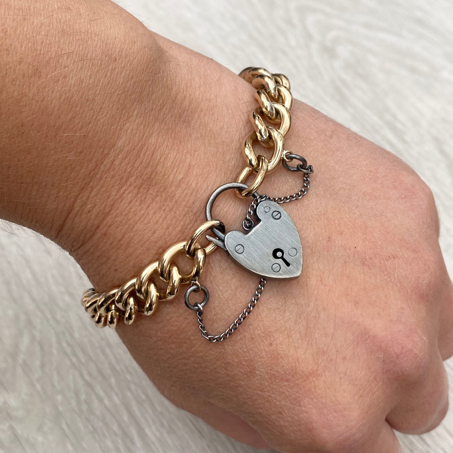 Vintage rolled gold curb chain 7.5" bracelet with a renewed oxidised silver heart locket