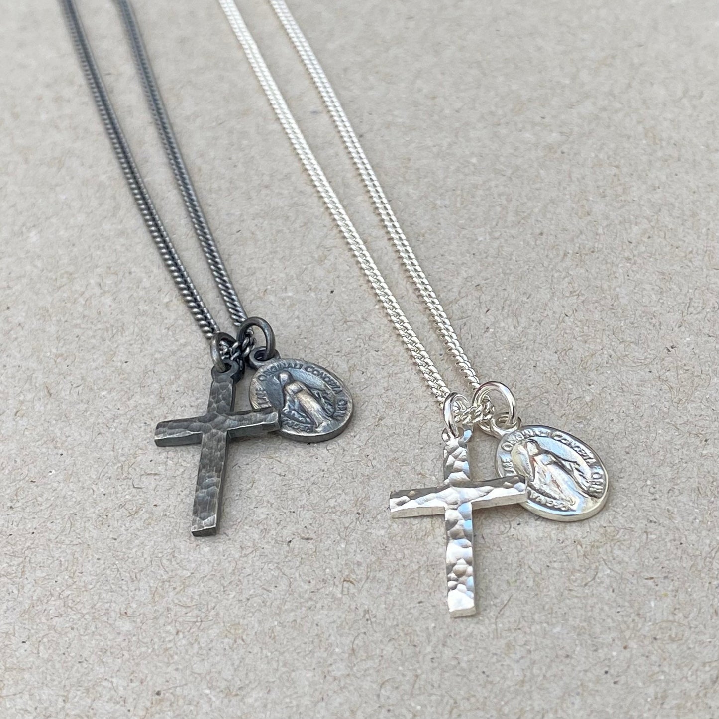 Oxidised or polished small solid silver hammered cross pendant and petite Miraculous Medal on a curb chain