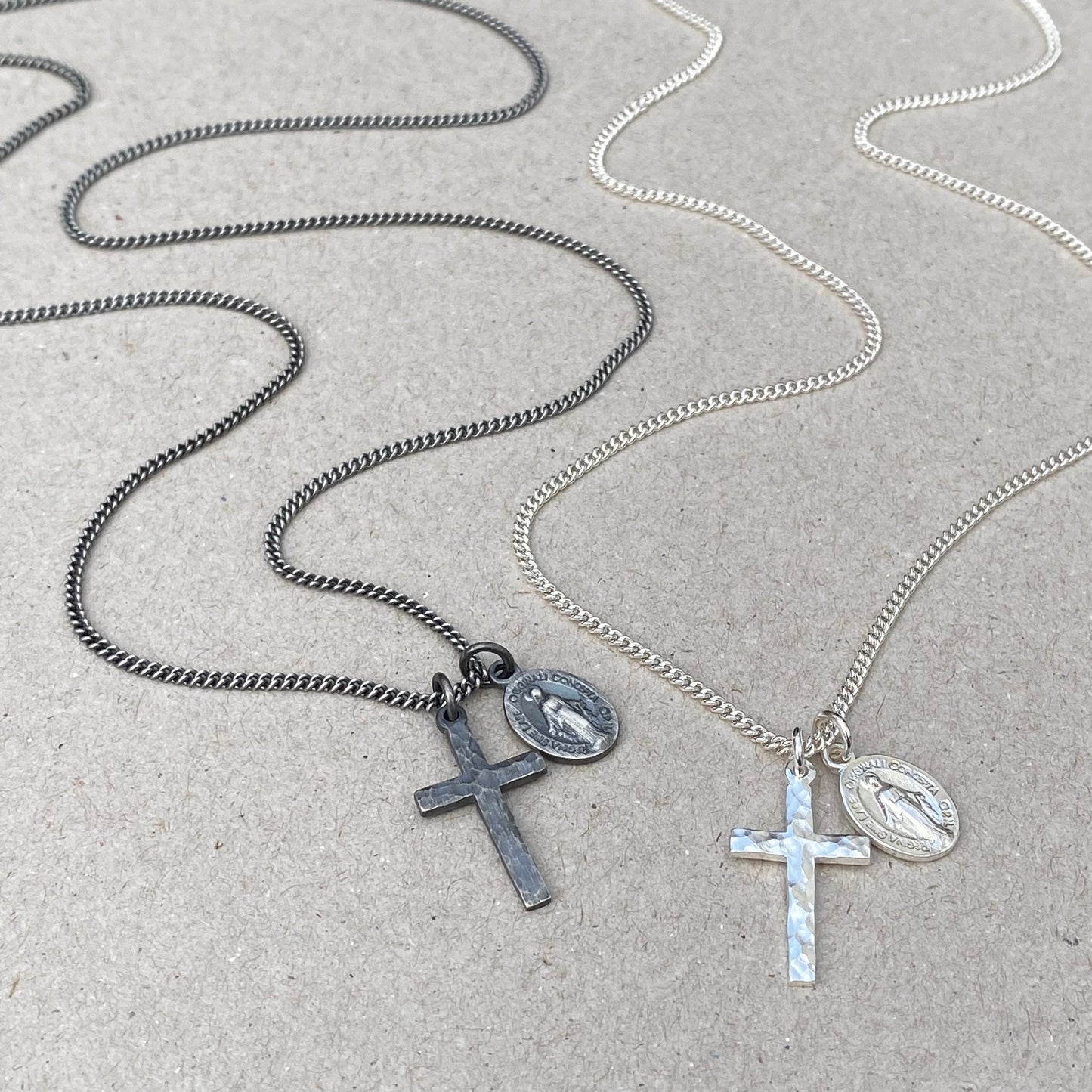 Oxidised or polished small solid silver hammered cross pendant and petite Miraculous Medal on a curb chain