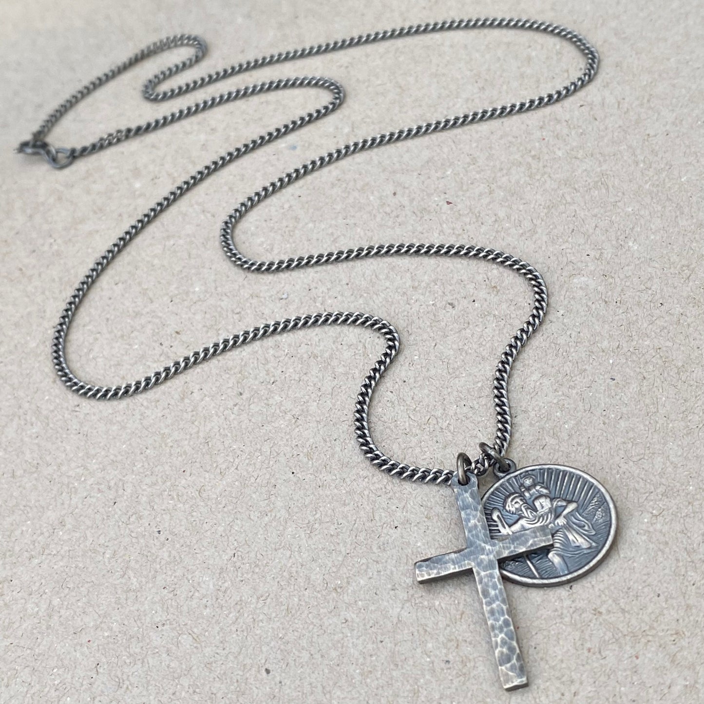 Oxidised or polished standard size solid silver hammered cross and round Saint Christopher pendants on a tight curb chain