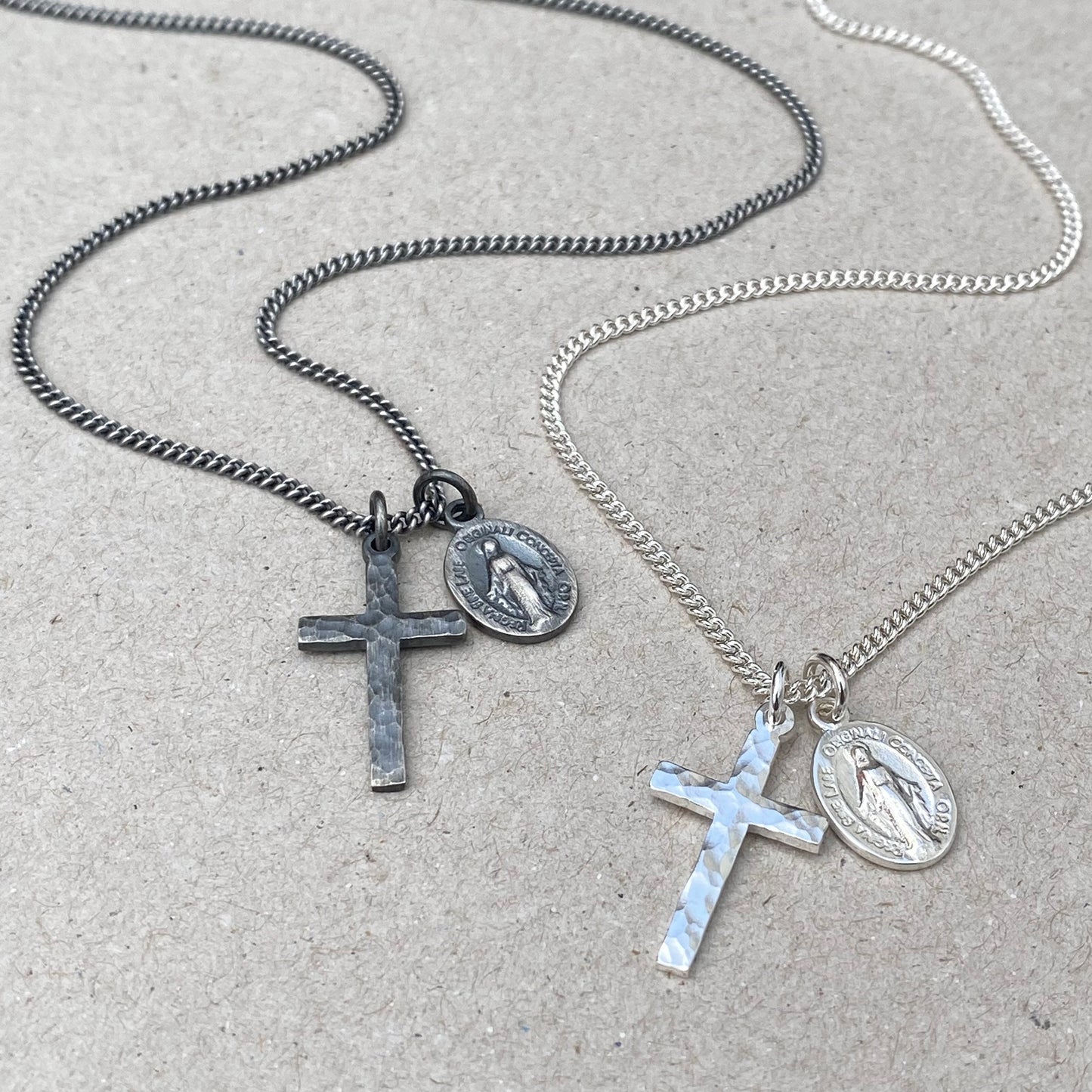 Oxidised or polished small solid silver hammered cross pendant and petite Miraculous Medal on a curb chain