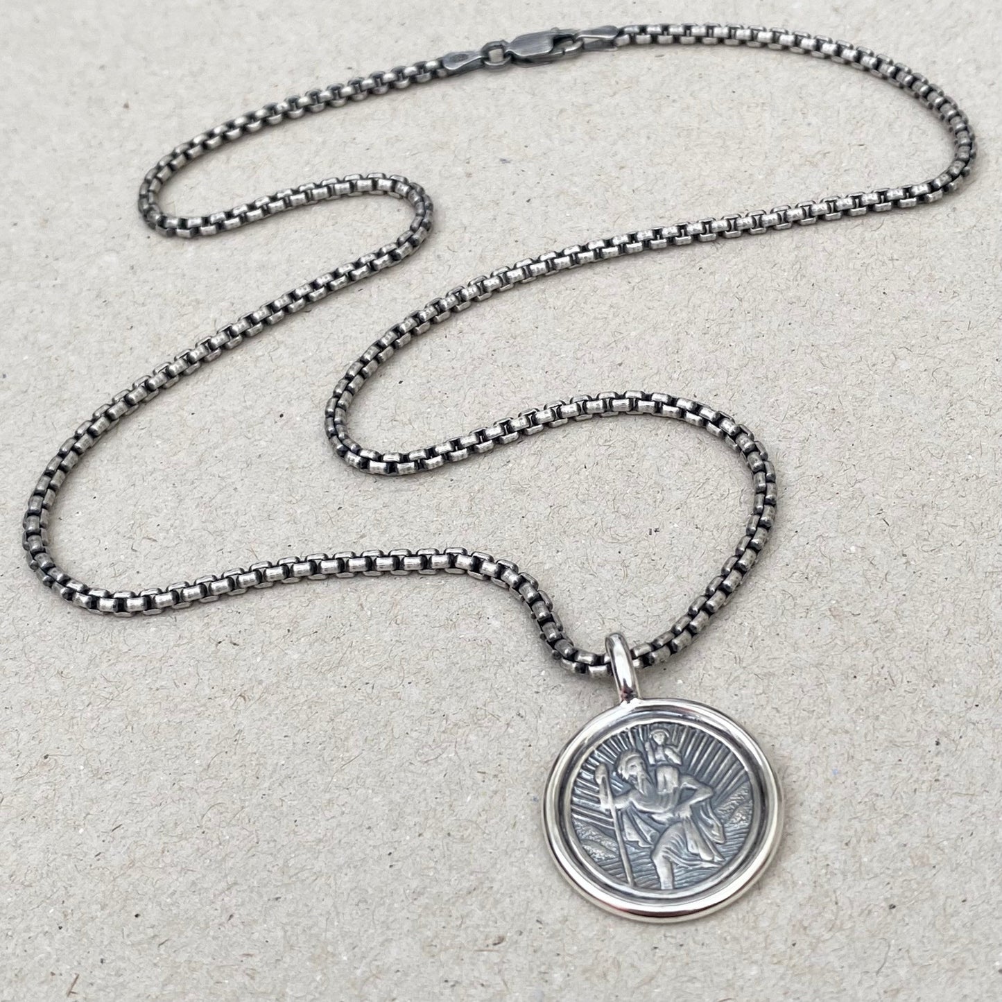 Oxidised solid silver Saint Christopher framed circle pendant on a 2.5mm wide round box belcher chain