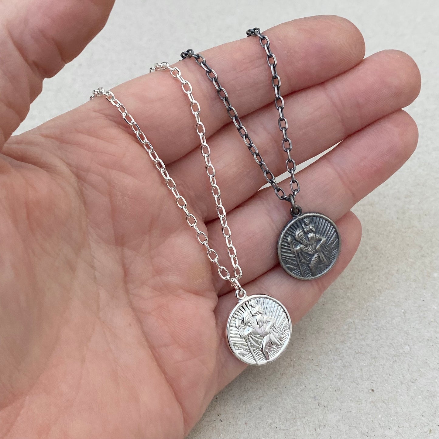 Oxidised or polished solid silver round Saint Christopher pendant on a diamond cut trace chain