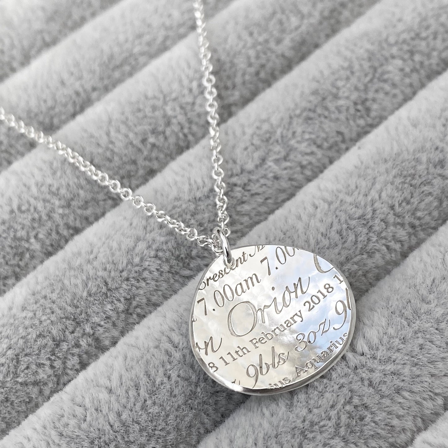 Handmade personalised solid silver 19mm baby birth charm details pendant on a trace chain