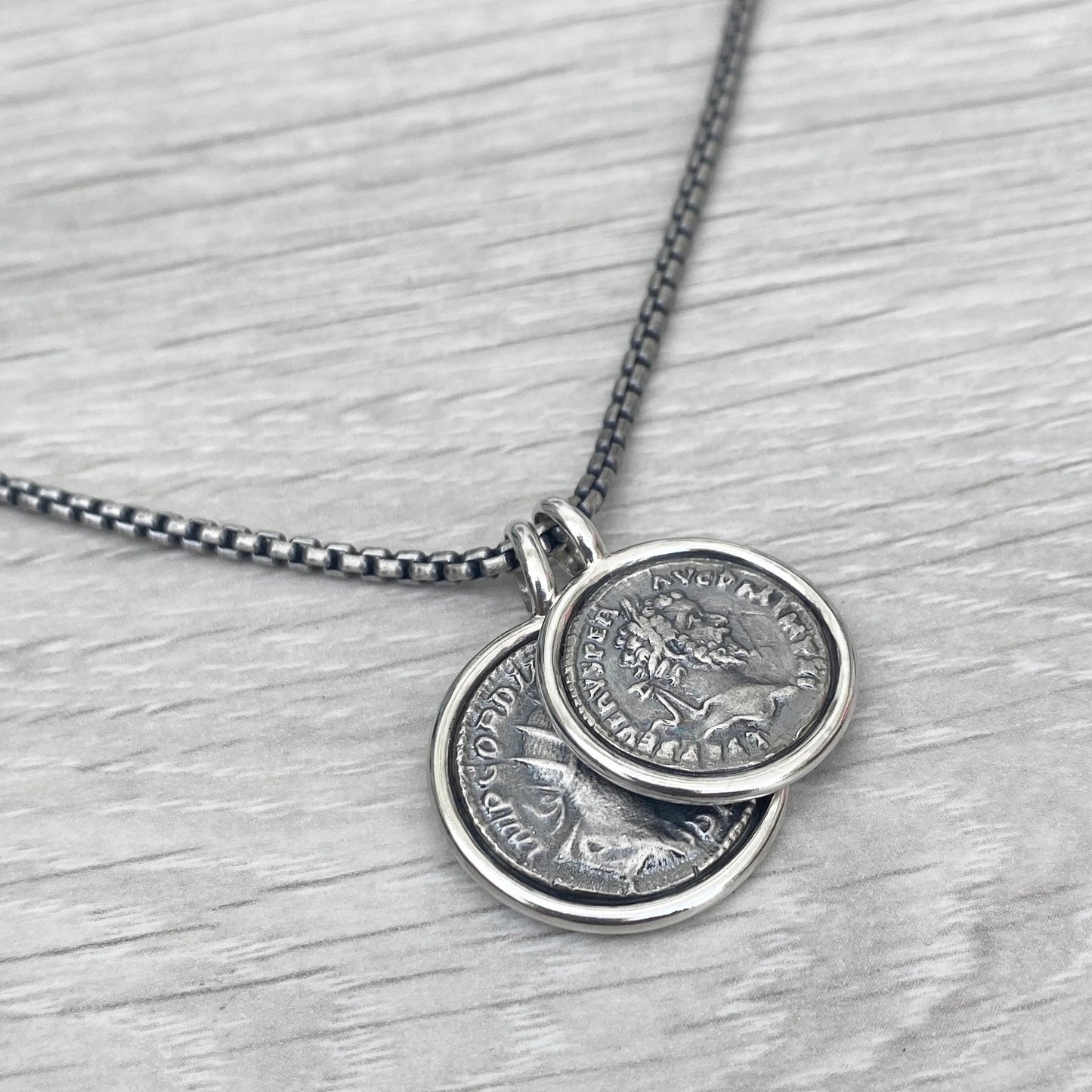 Oxidised solid Sterling silver replica Roman coin circle framed pendants on a choice of trace or round box chain