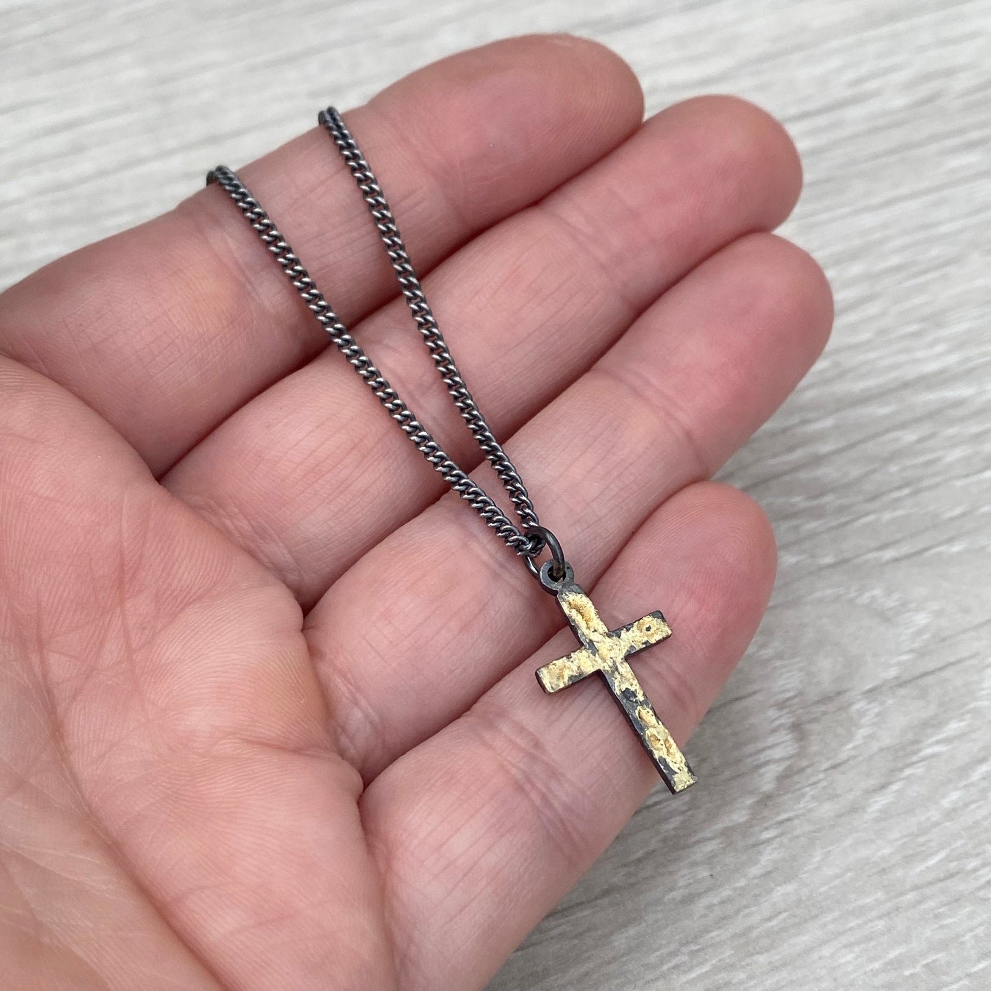 Oxidised reticulated silver and gold small size cross pendant on a 22" curb chain