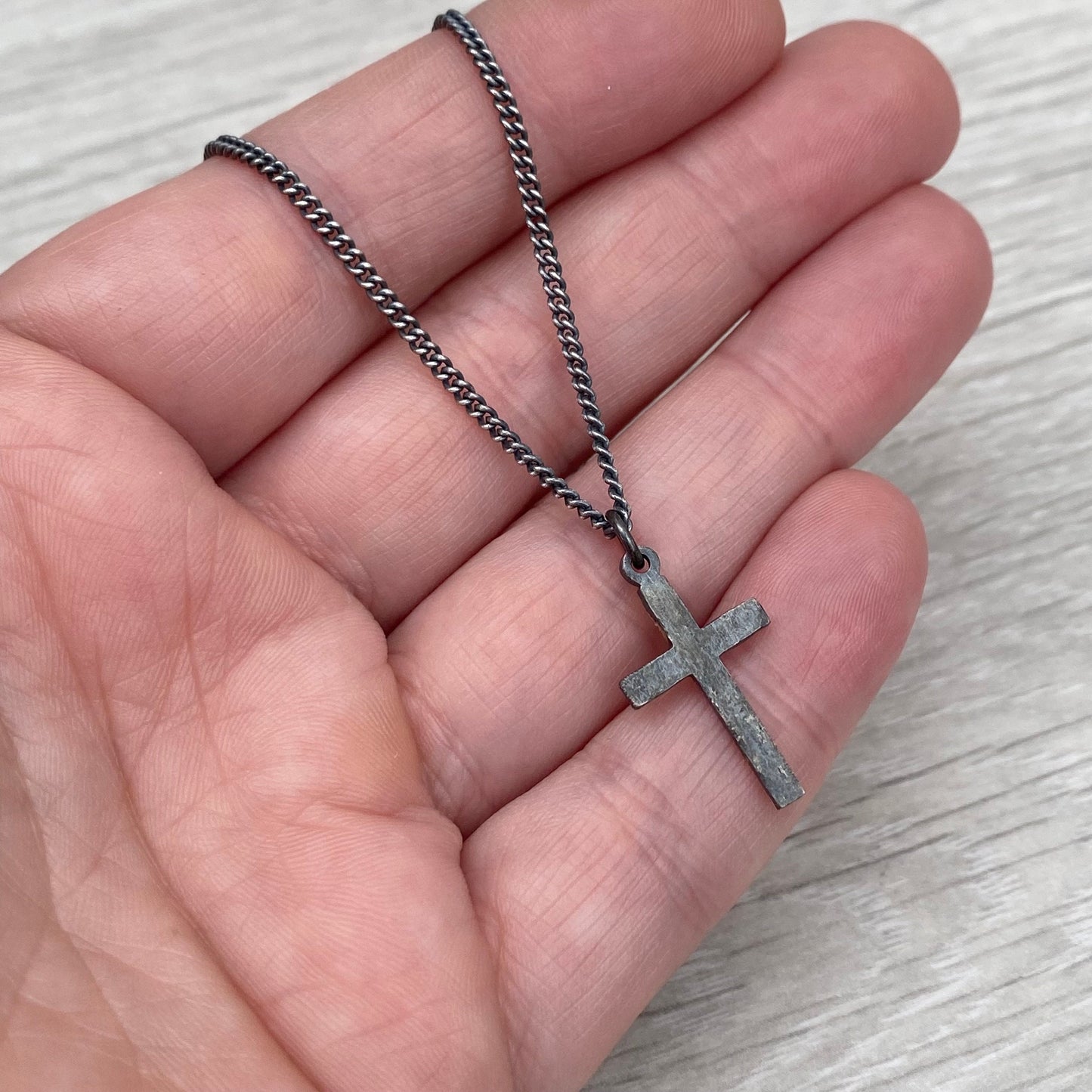 Oxidised reticulated silver and gold small size cross pendant on a 22" curb chain