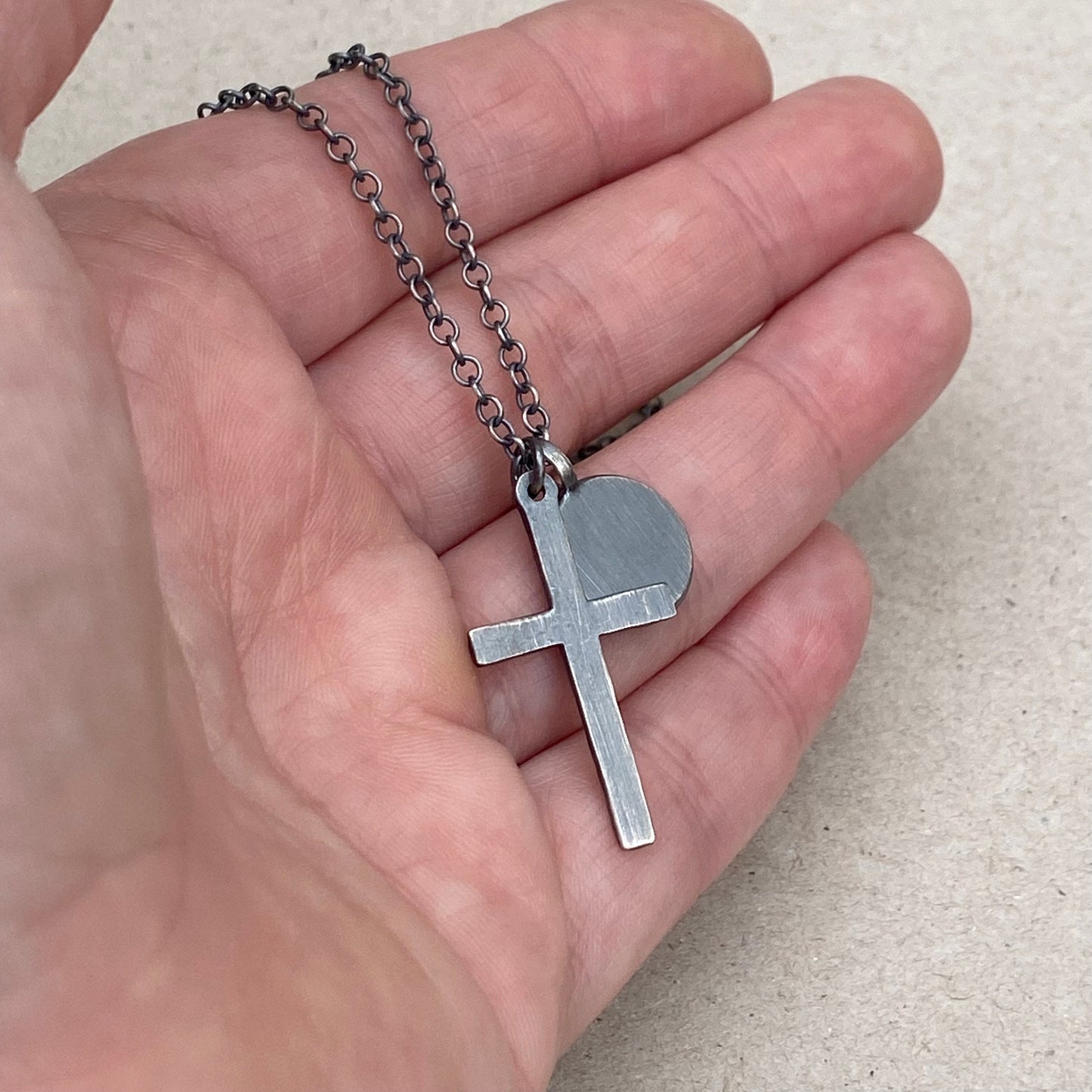 Oxidised silver star engraved birthstone 13mm pendant and hammered cross on a trace chain