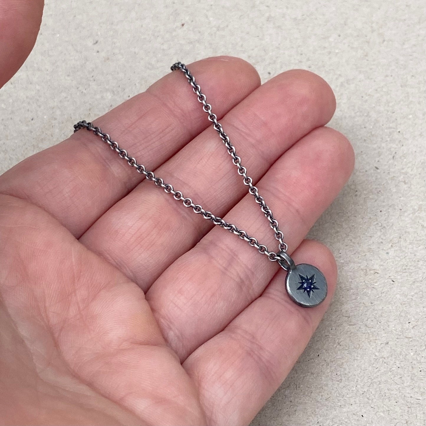 Oxidised silver star engraved birthstone 10mm pendant on a tight trace chain