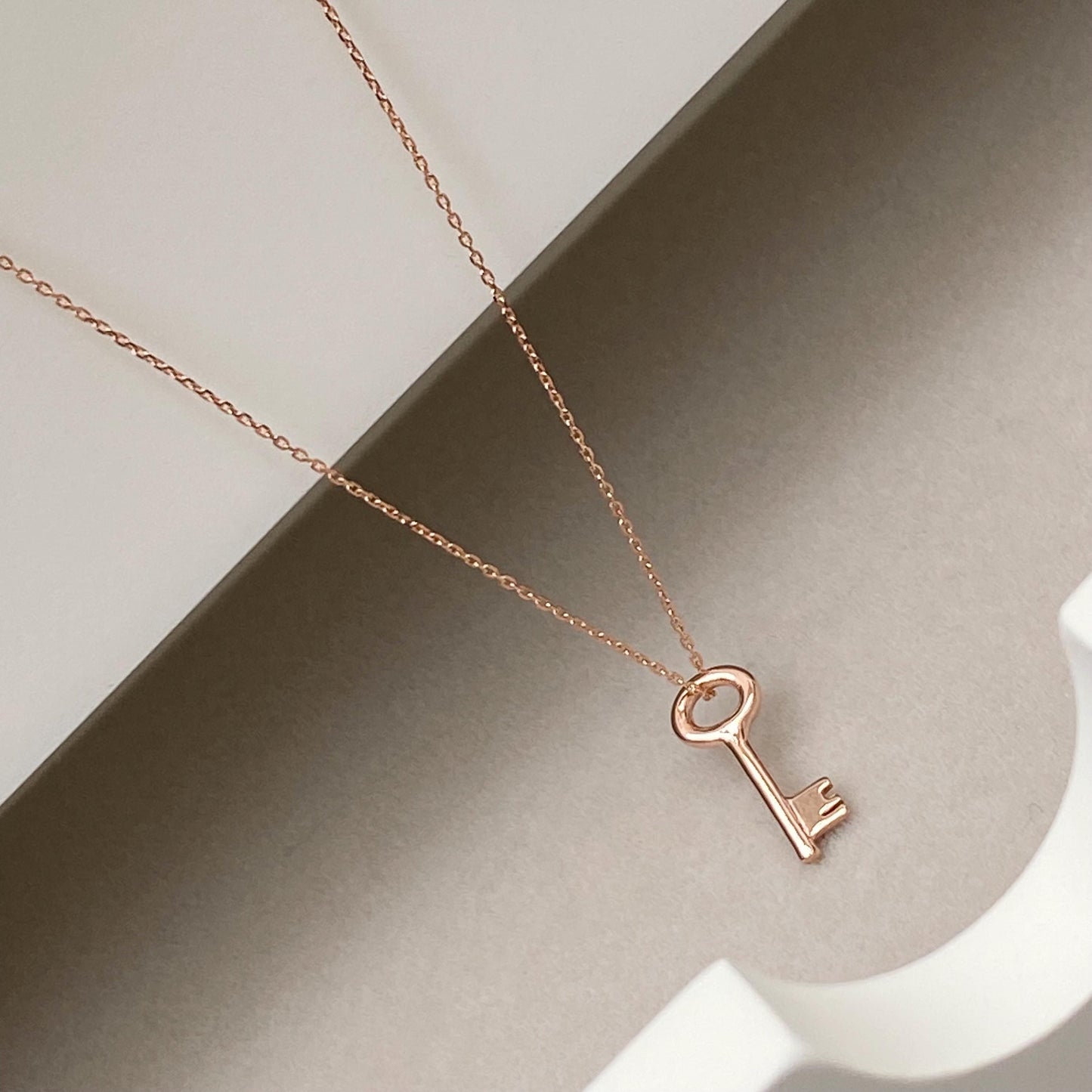 9ct solid rose gold small and dainty key charm pendant and chain