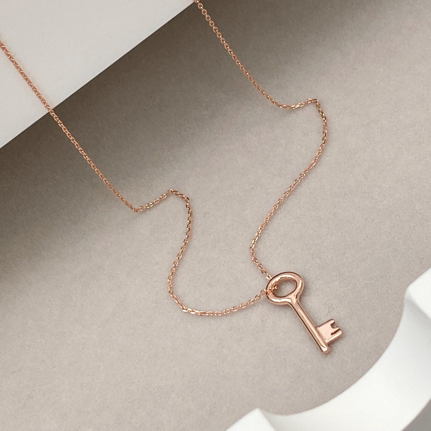 9ct solid rose gold small and dainty key charm pendant and chain