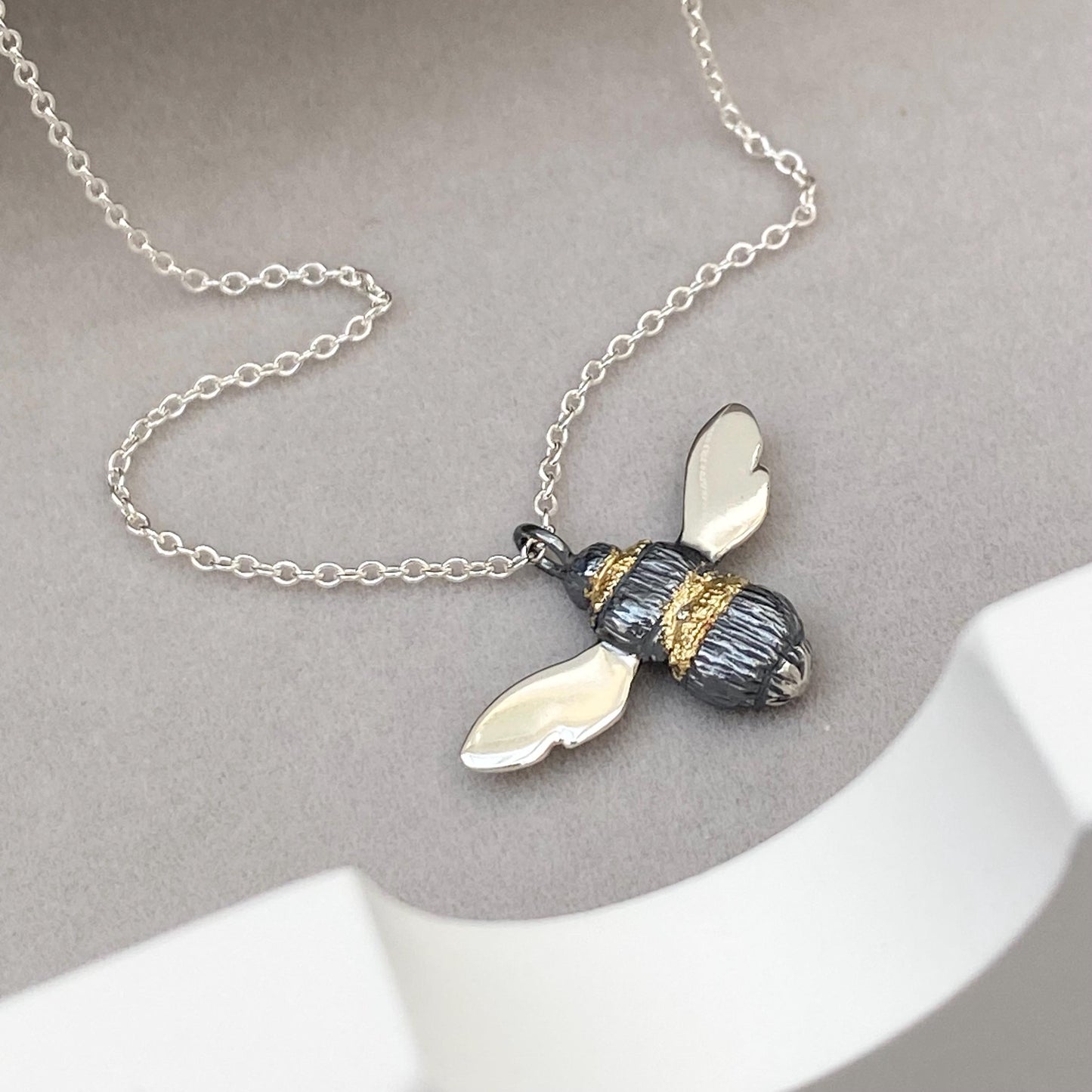 Oxidised solid silver and gold detail Bumblebee pendant on a silver trace chain