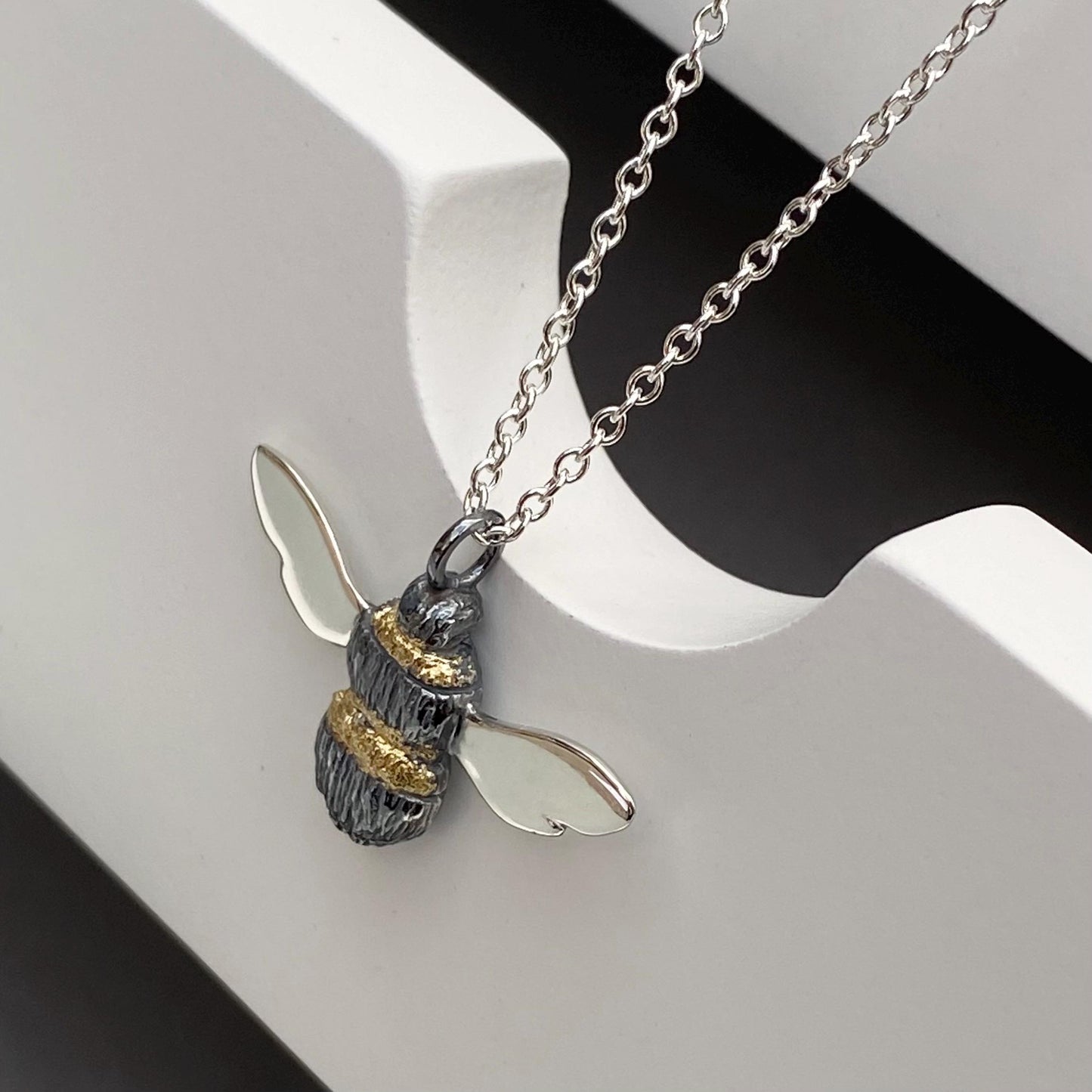Oxidised solid silver and gold detail Bumblebee pendant on a silver trace chain