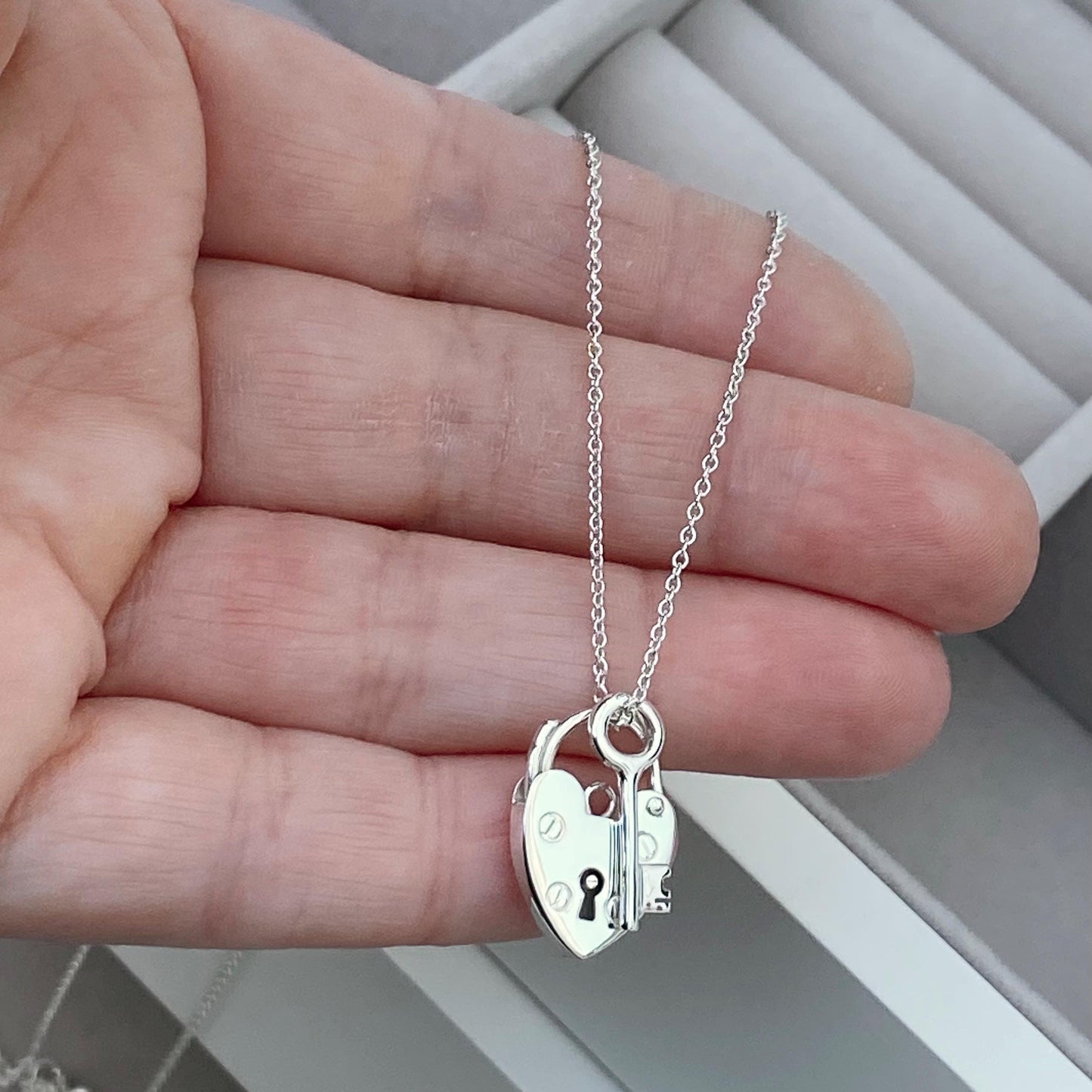 Solid silver heart padlock and dainty key charm pendant on a trace chain