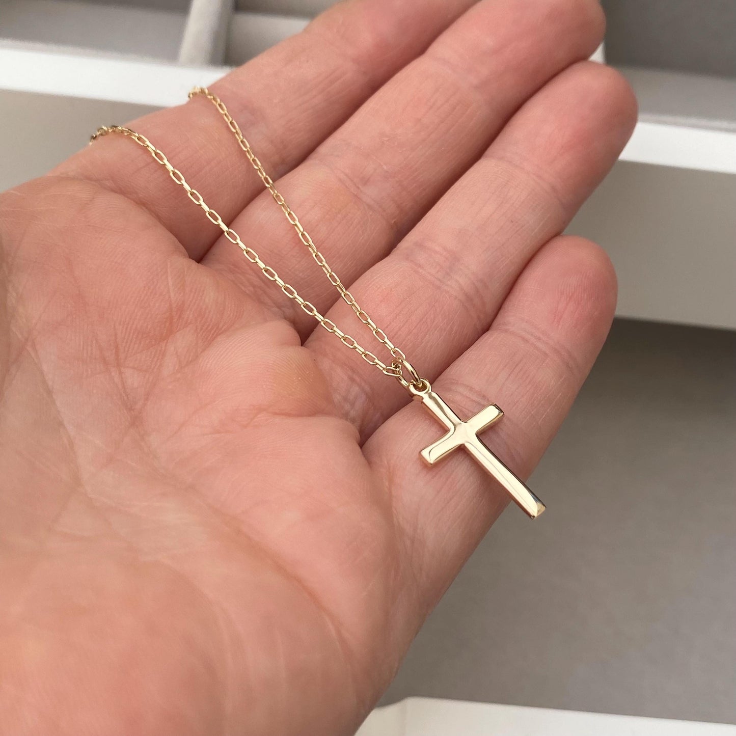 9ct solid yellow gold small cross pendant on a 1.1mm wide diamond cut trace chain