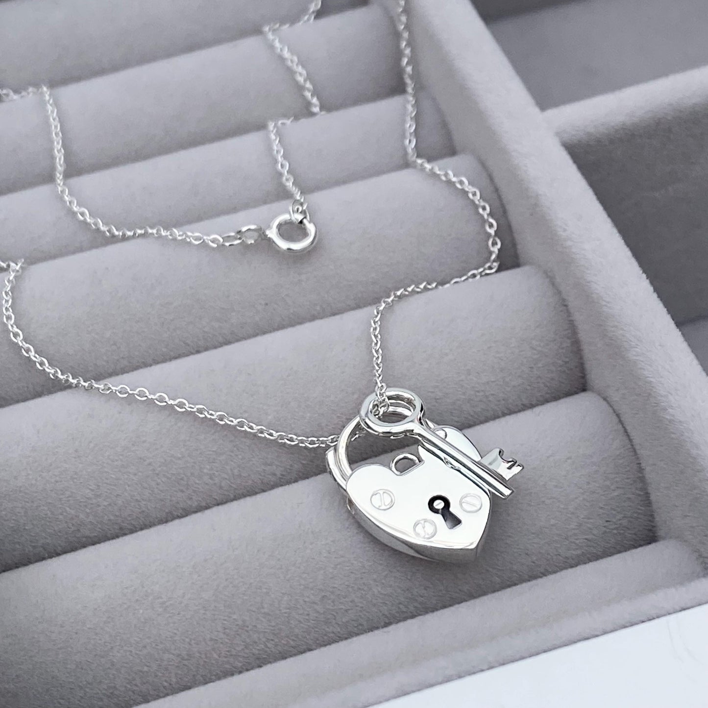 Solid silver heart padlock and dainty key charm pendant on a trace chain