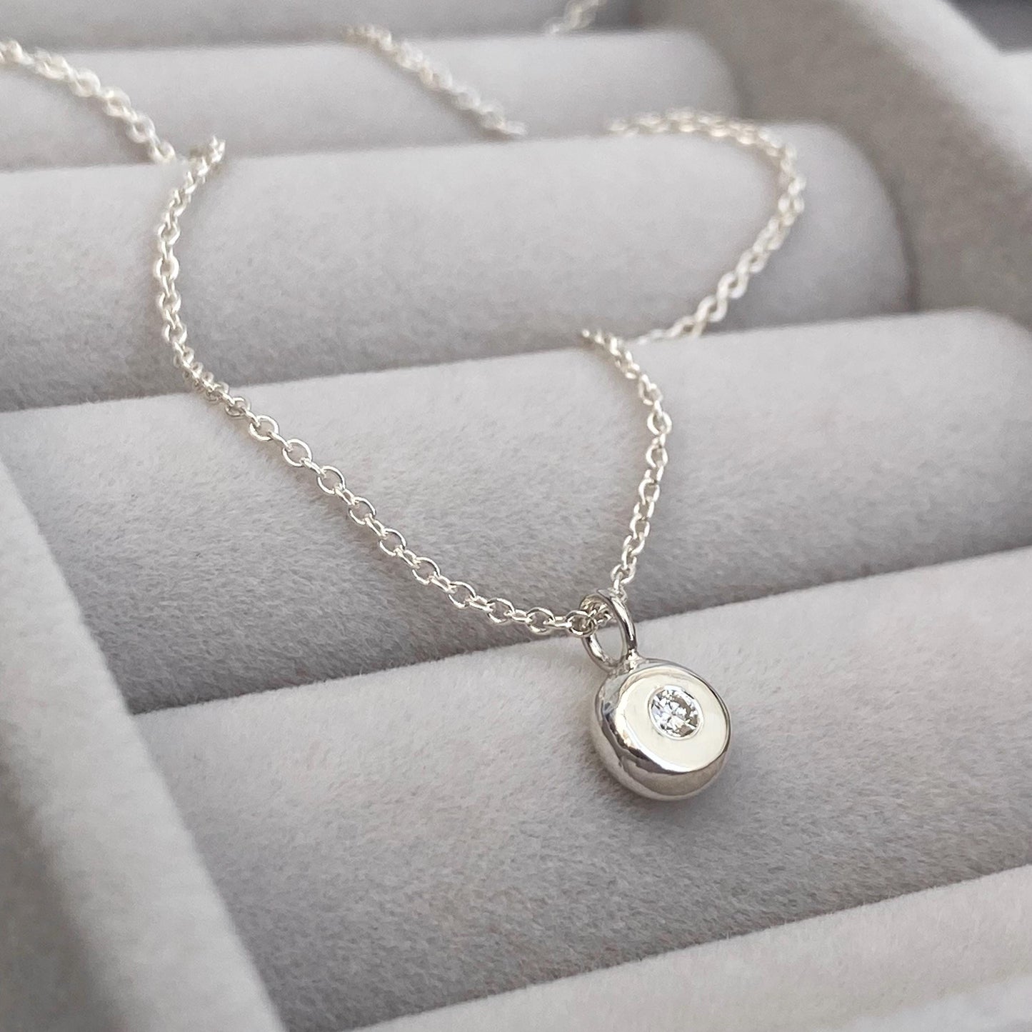 Handmade 2mm round natural diamond silver nugget pendant on a trace chain