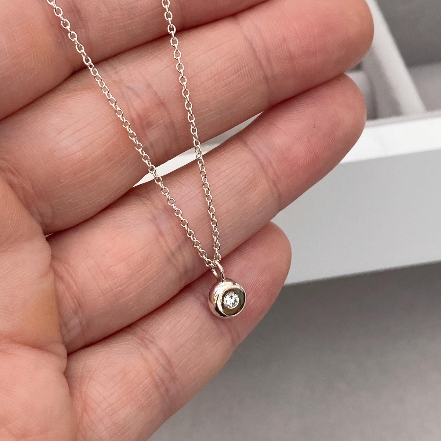 Handmade 2mm round natural diamond silver nugget pendant on a trace chain
