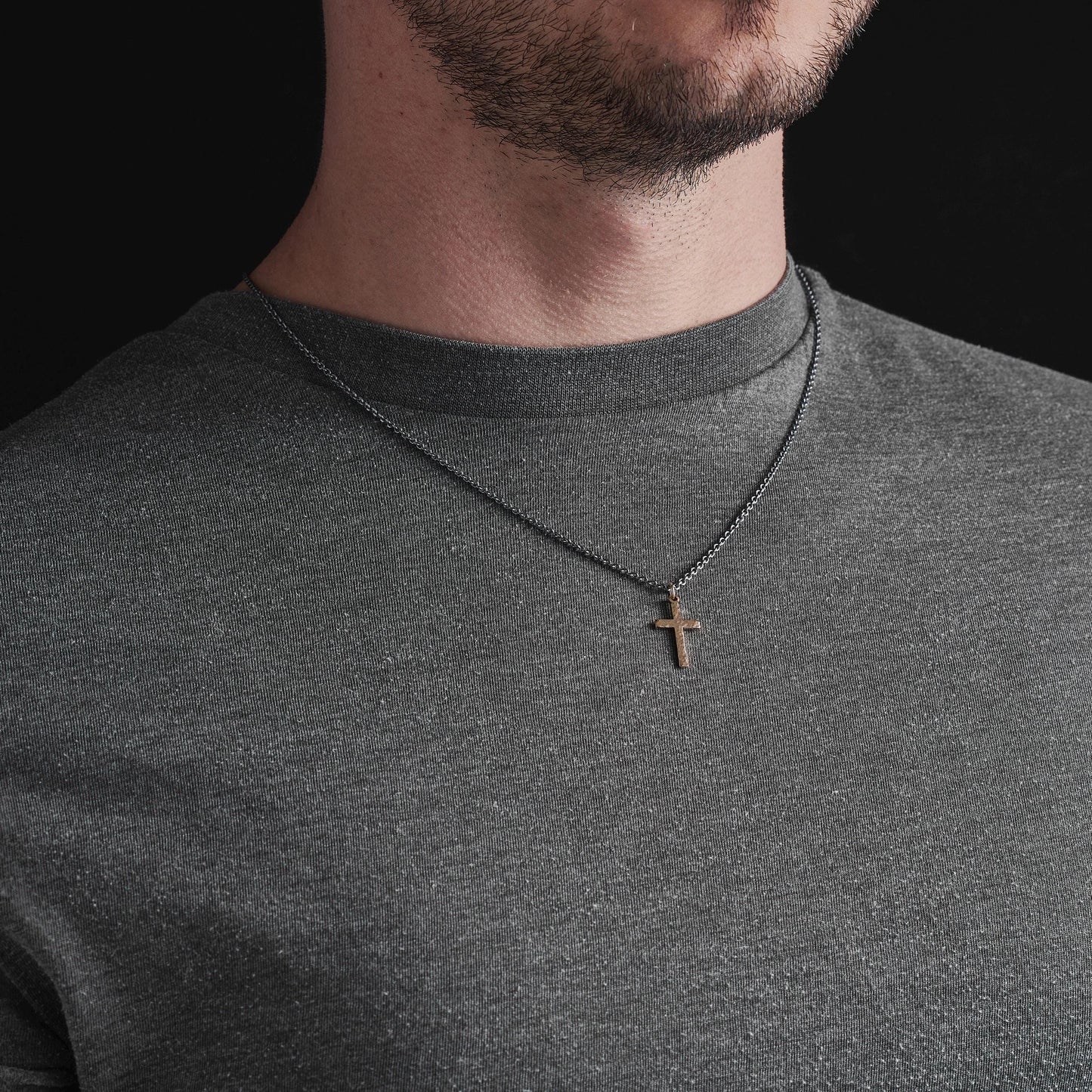 Polished small size 9ct yellow gold hammered cross pendant on a oxidised silver round box chain