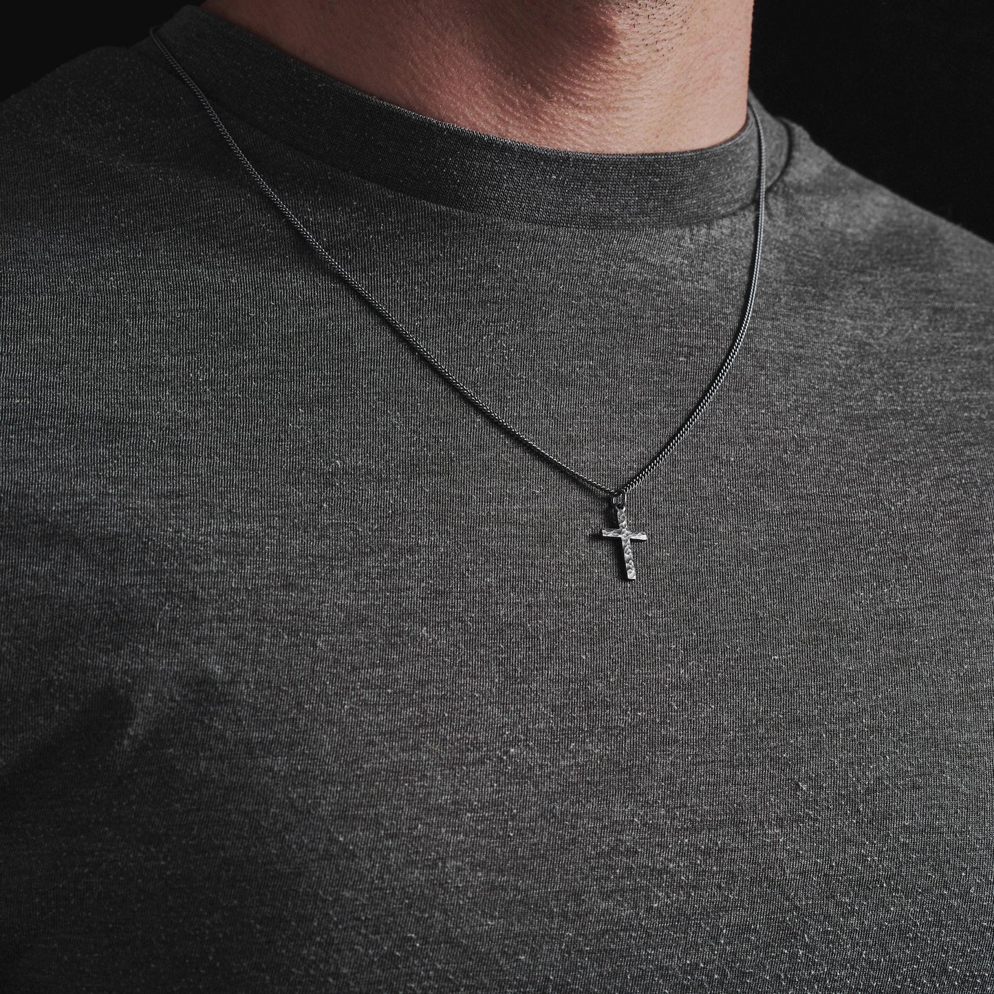 Oxidised or polished solid silver hammered finish small, standard, and medium cross pendants on a curb chain