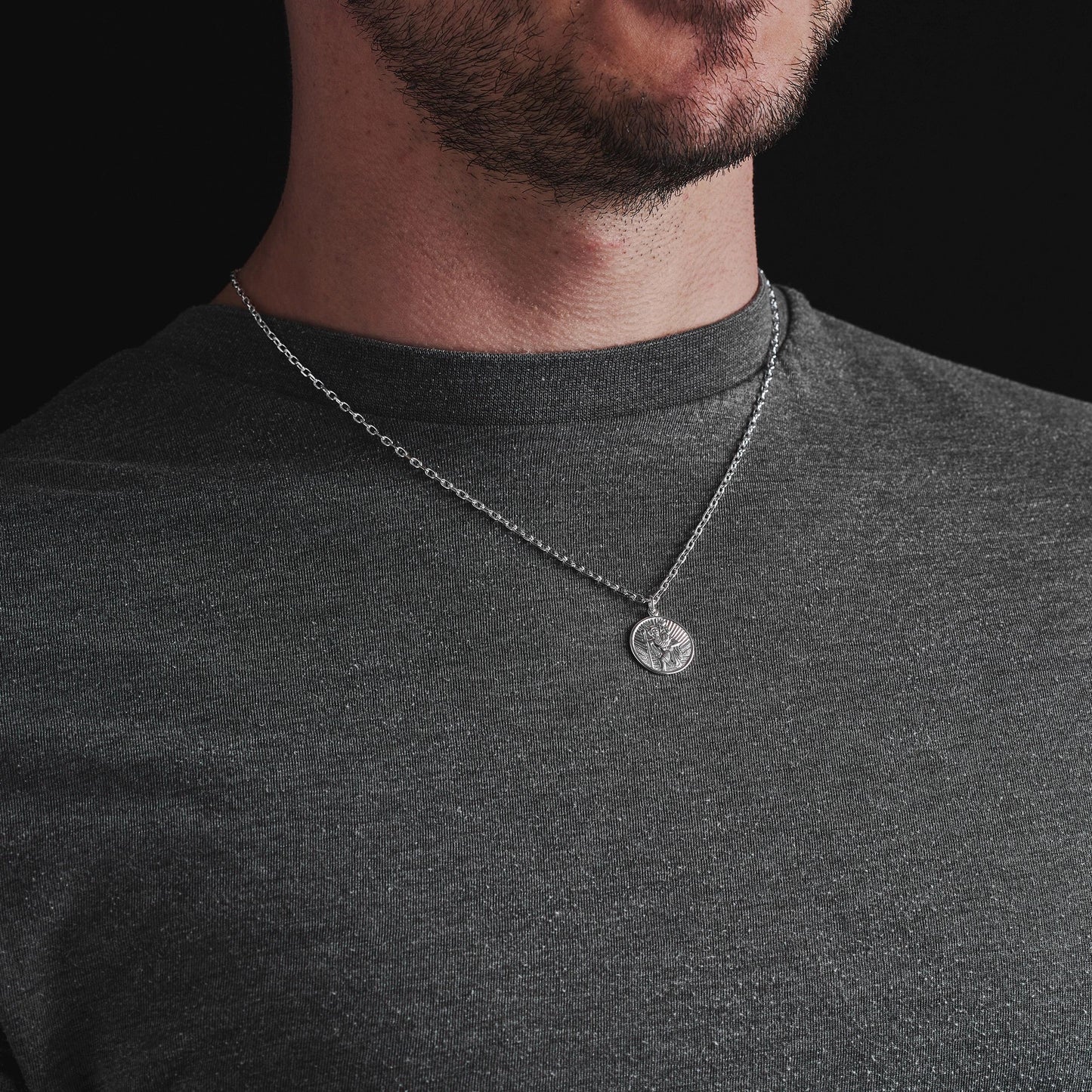 Oxidised or polished solid silver round Saint Christopher pendant on a diamond cut trace chain