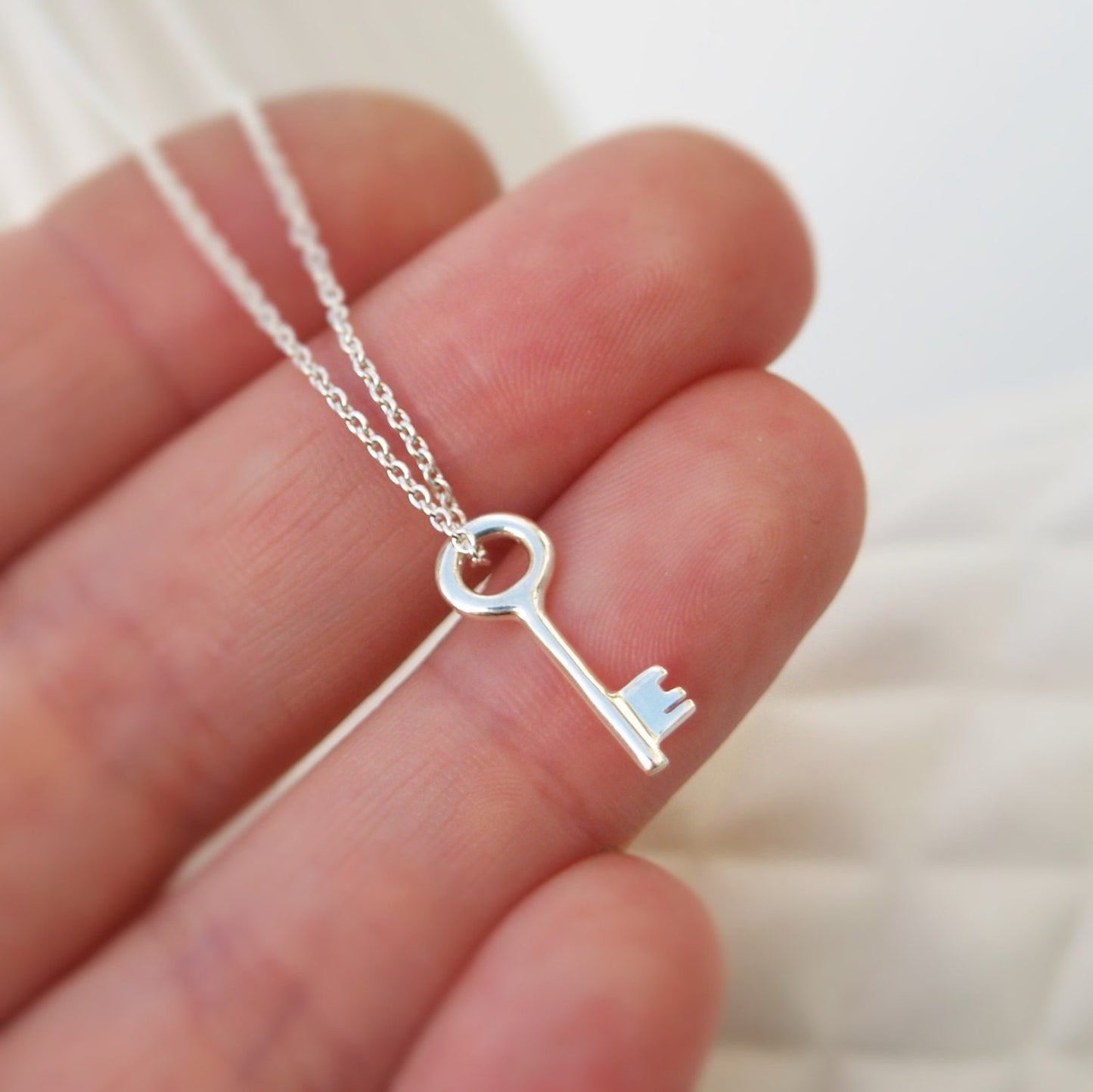 Solid polished silver small and dainty key charm pendant and trace chain