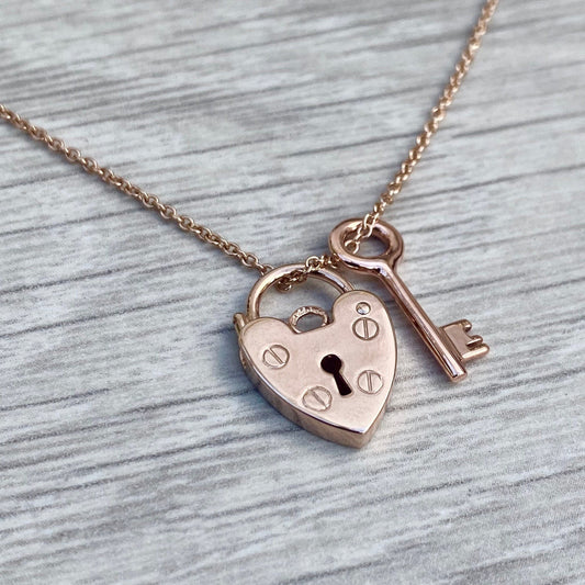 9ct solid rose gold heart padlock and small key charm pendants on a 1.2mm wide trace chain