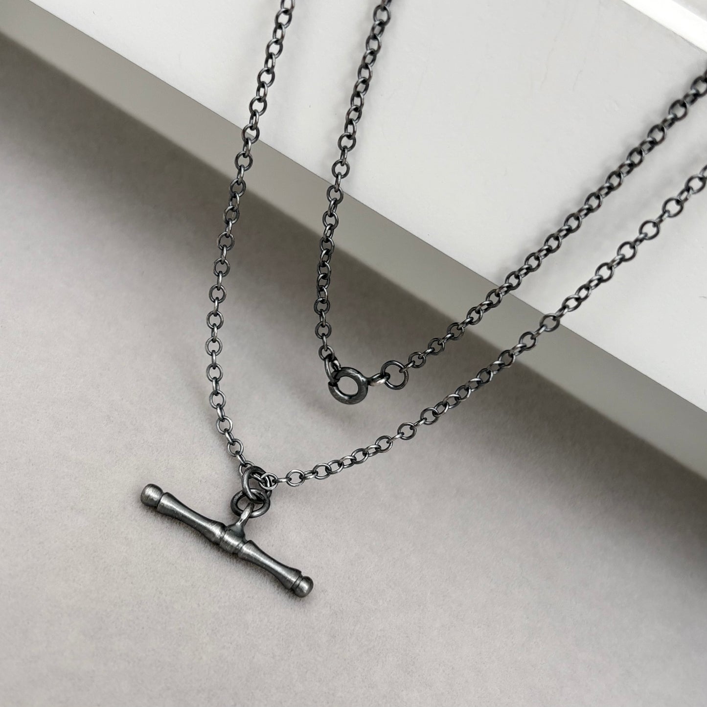 Oxidised or polished solid sterling silver T-bar pendant on a trace chain