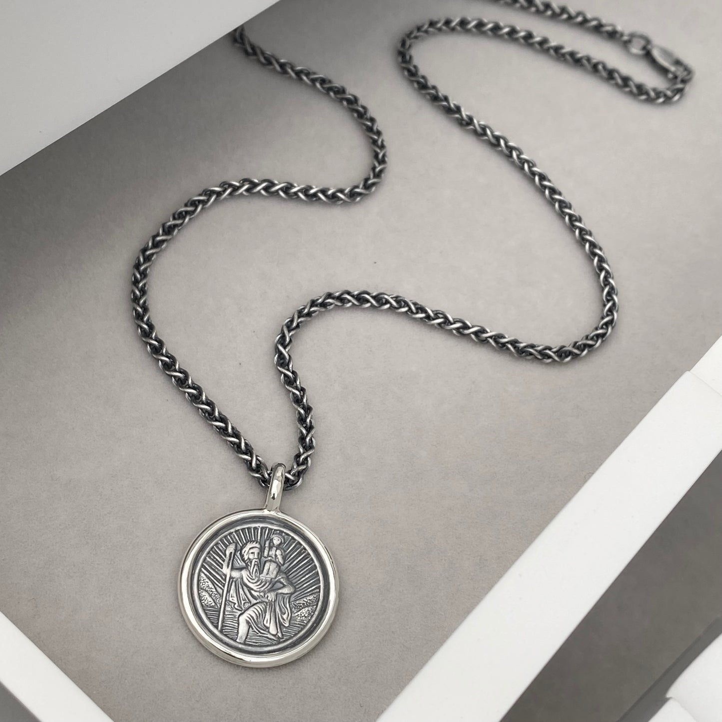Oxidised or polished solid silver round Saint Christopher framed pendant on a 2.5mm wide spiga chain