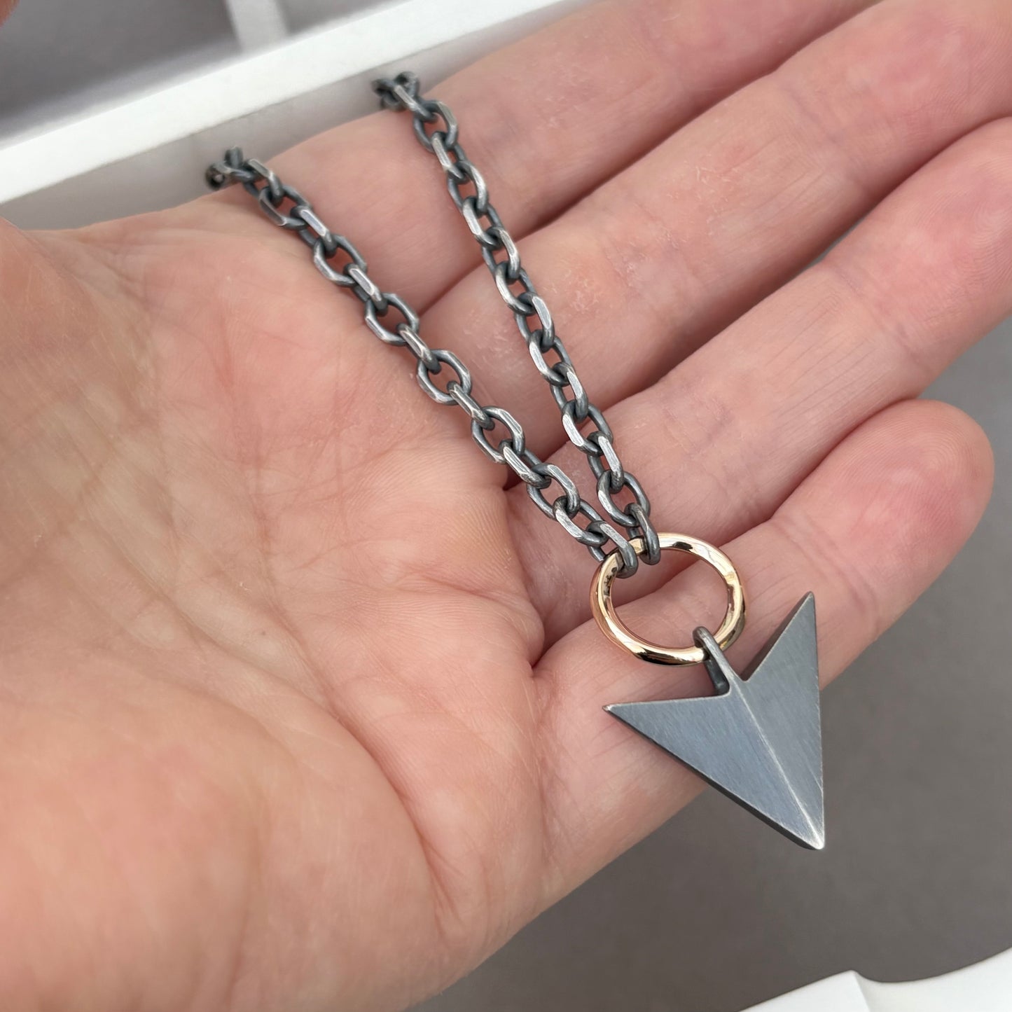 Oxidised or polished sterling silver large arrow and 9ct yellow gold loop pendant on a diamond cut trace chain