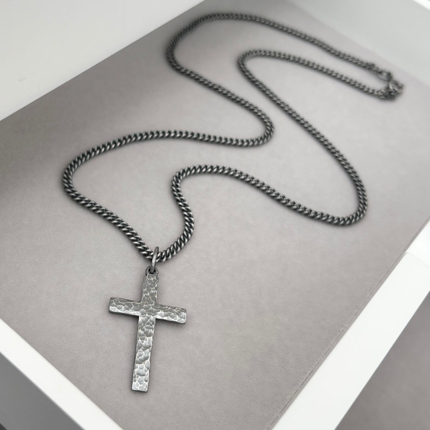 Oxidised or polished medium size sterling silver hammered cross pendant on a curb chain