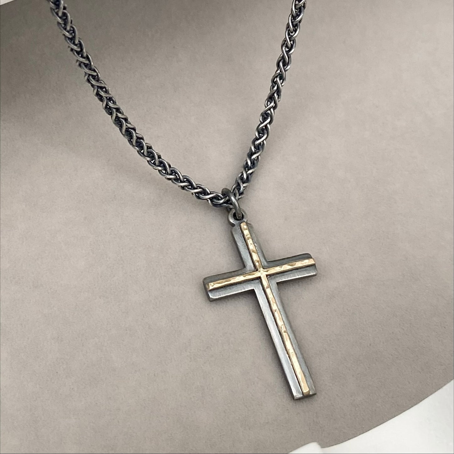 Oxidised solid sterling silver and hammered 9ct yellow gold medium cross pendant on an oxidised silver spiga chain