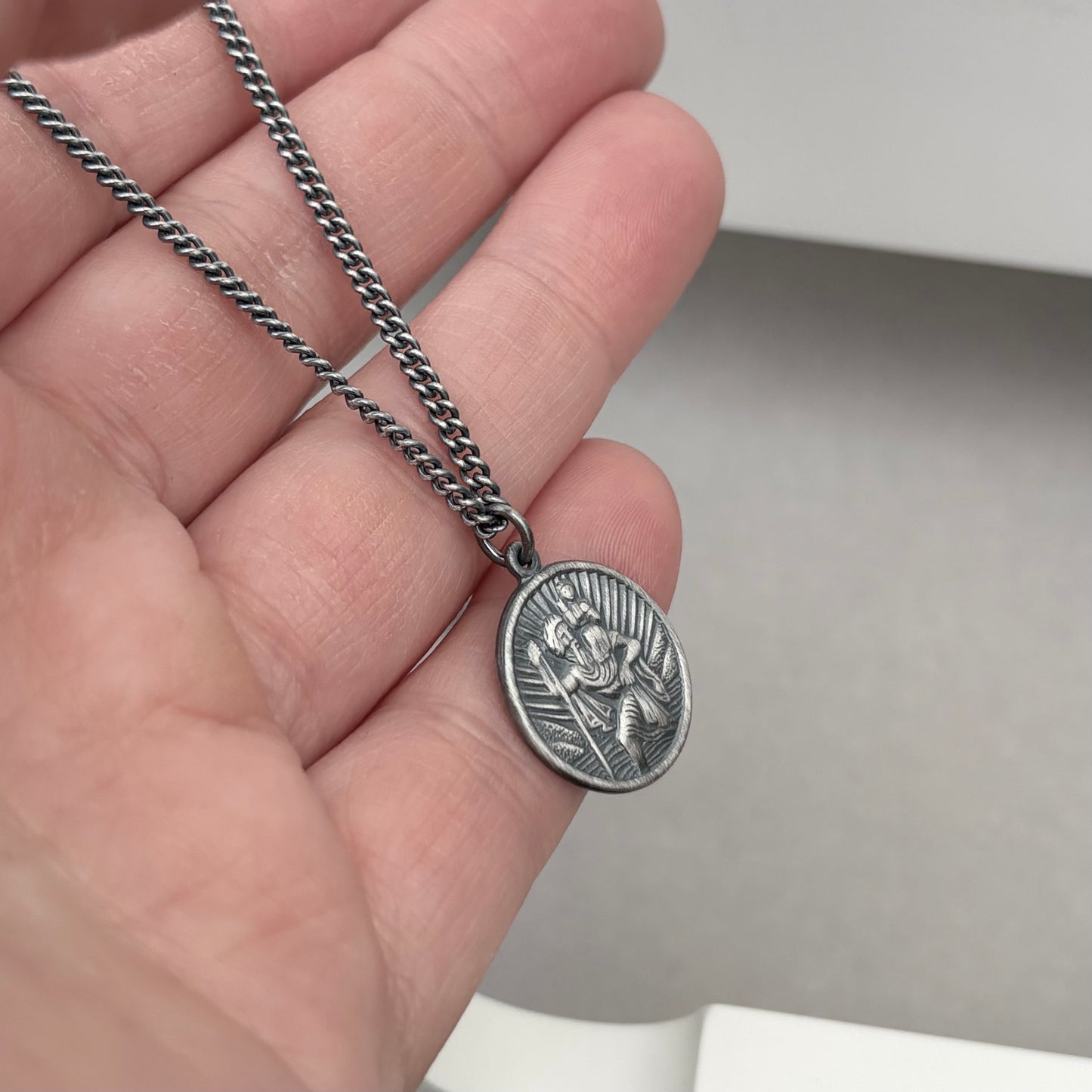 Oxidised or polished solid sterling silver round Saint Christopher pendant on a curb chain