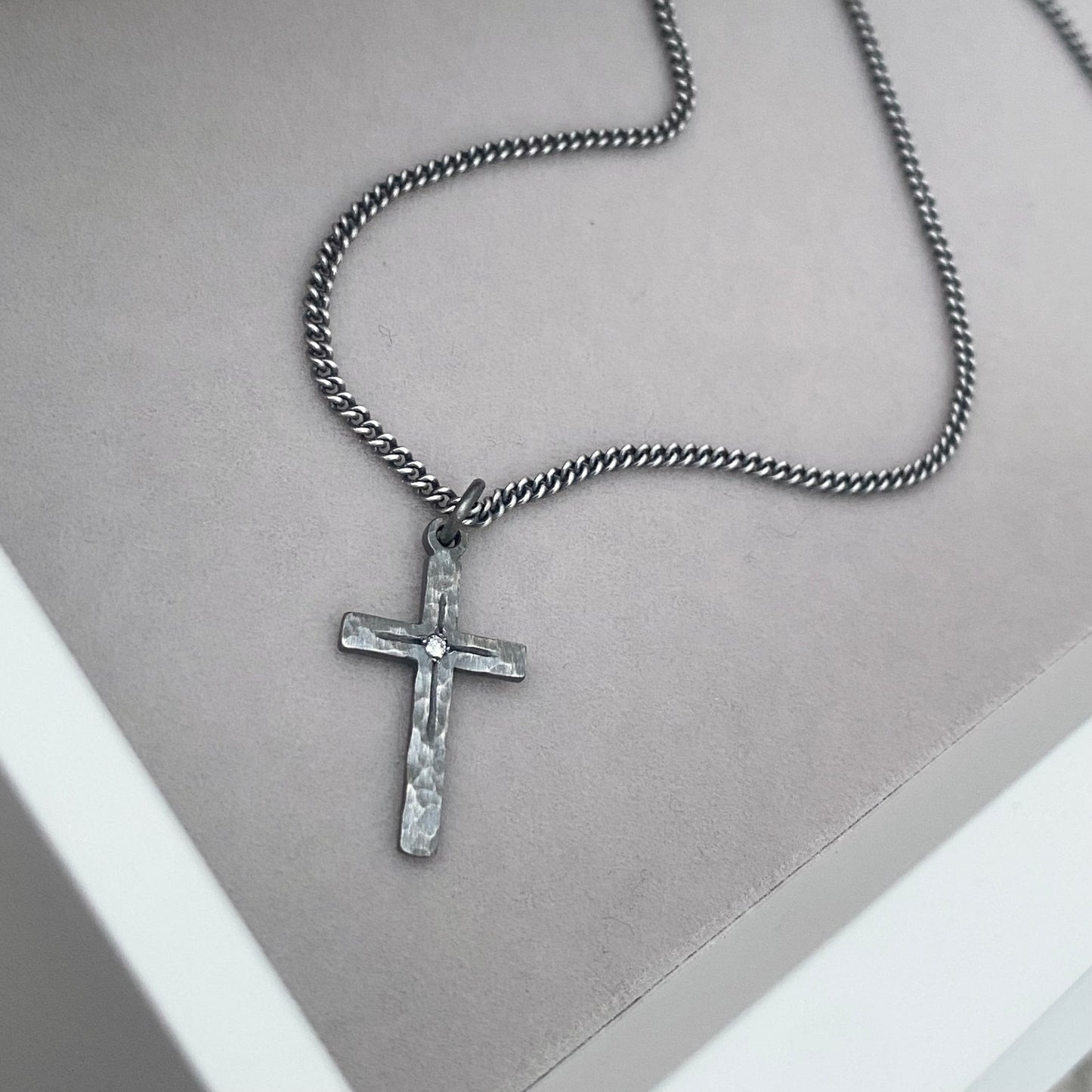 Oxidised solid sterling silver small or medium size diamond set cross pendants on a curb chain