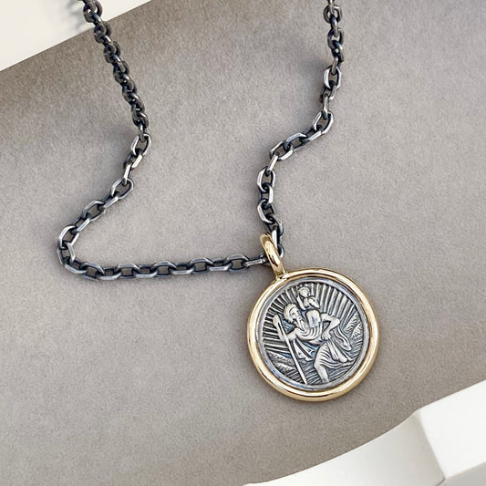 Oxidised solid silver round Saint Christopher 9ct yellow gold framed pendant on diamond cut trace chain