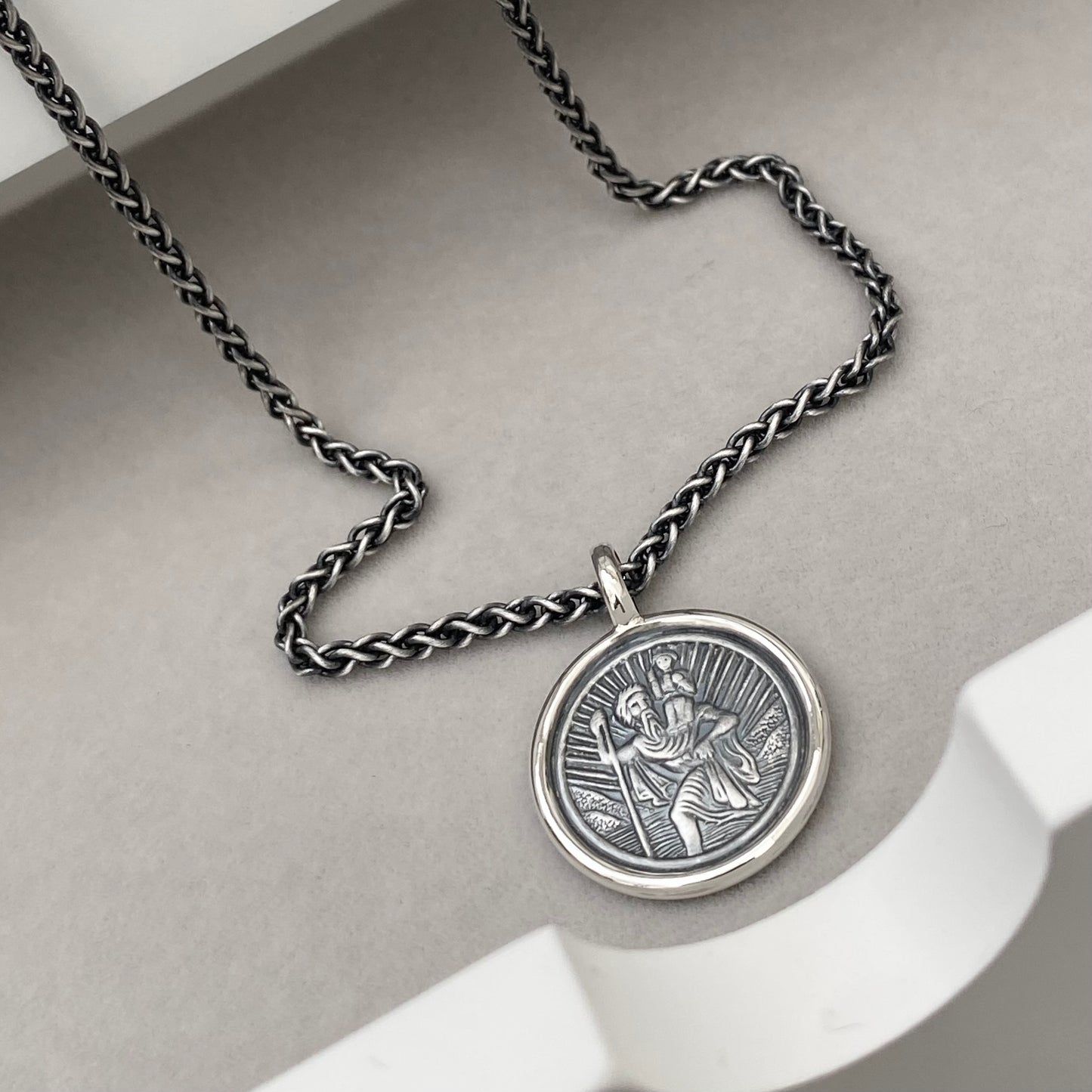 Oxidised or polished solid silver round Saint Christopher framed pendant on a 2.5mm wide spiga chain