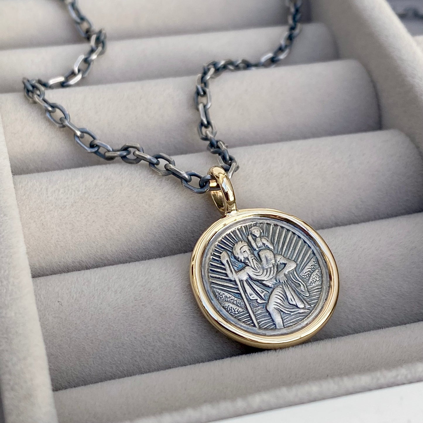 Oxidised solid silver round Saint Christopher 9ct yellow gold framed pendant on diamond cut trace chain
