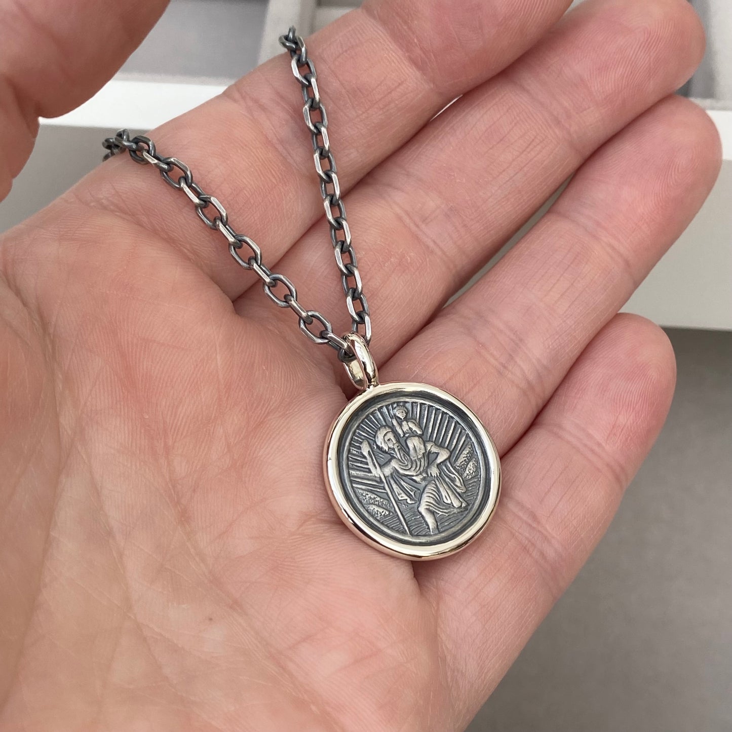 Oxidised solid silver Saint Christopher circle framed pendant on a 2.9mm wide diamond cut trace chain