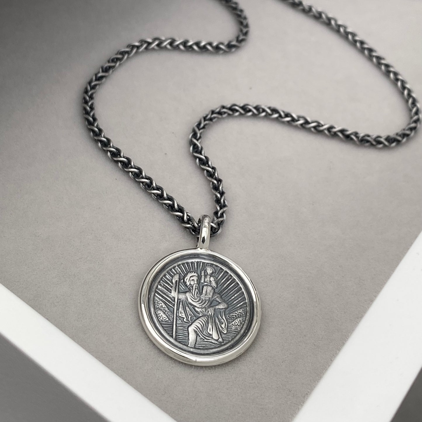 Oxidised or polished solid silver round Saint Christopher framed pendant on a 2.5mm wide spiga chain