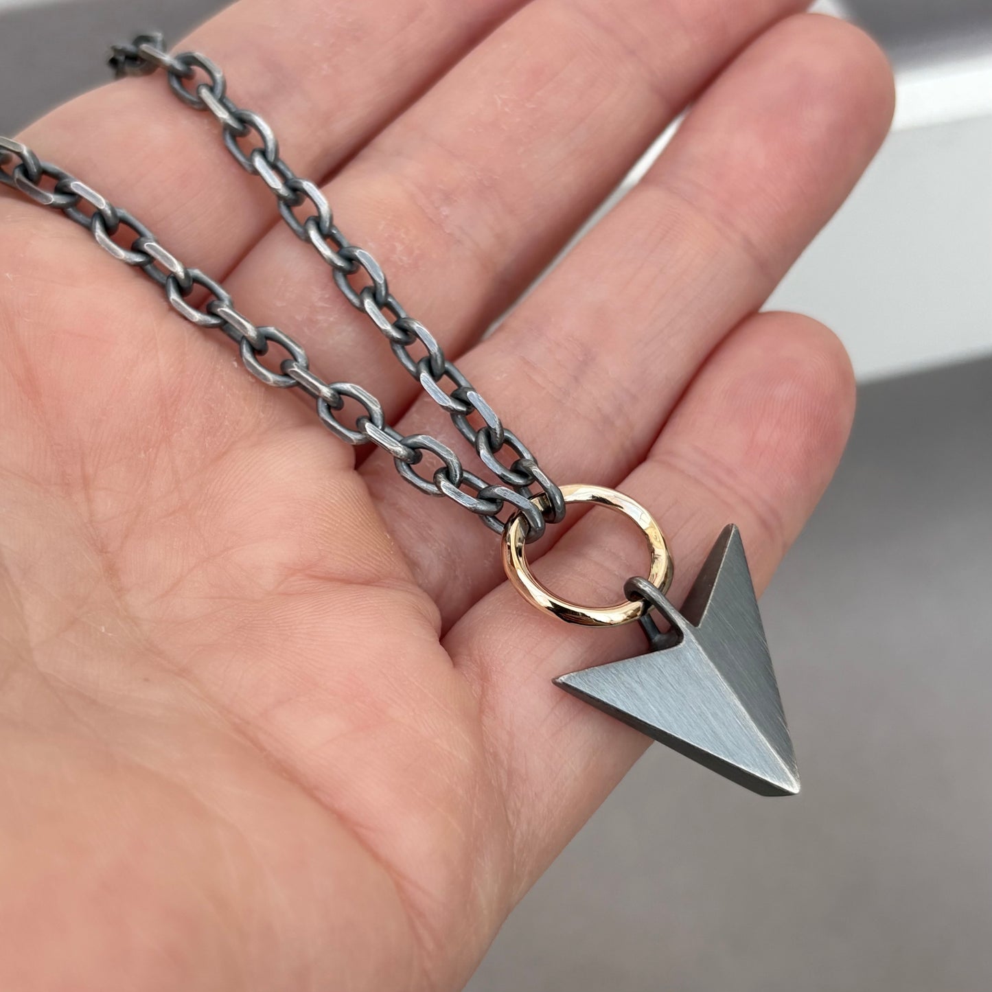 Oxidised or polished sterling silver large arrow and 9ct yellow gold loop pendant on a diamond cut trace chain