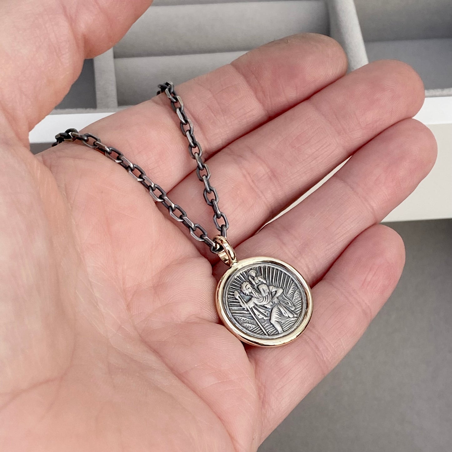 Oxidised solid silver round Saint Christopher 9ct yellow gold framed pendant on diamond cut trace chain